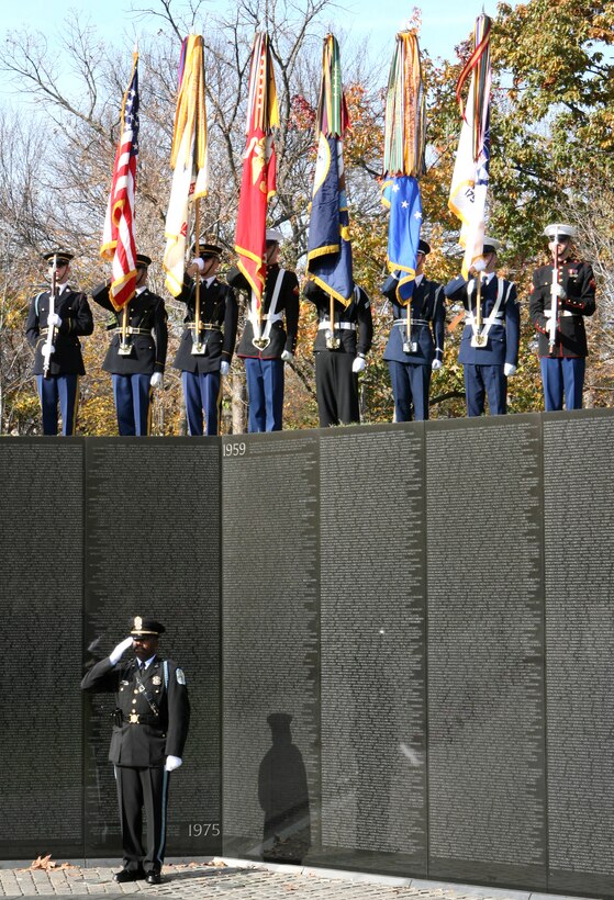 The Armed Forces Color Guard presents the services' colors and U.S. flag during the 15th Anniversary Commemoration of the Vietnam Women's Memorial at the Vietnam War Memorial in Washington, D.C., Nov. 11, 2008.