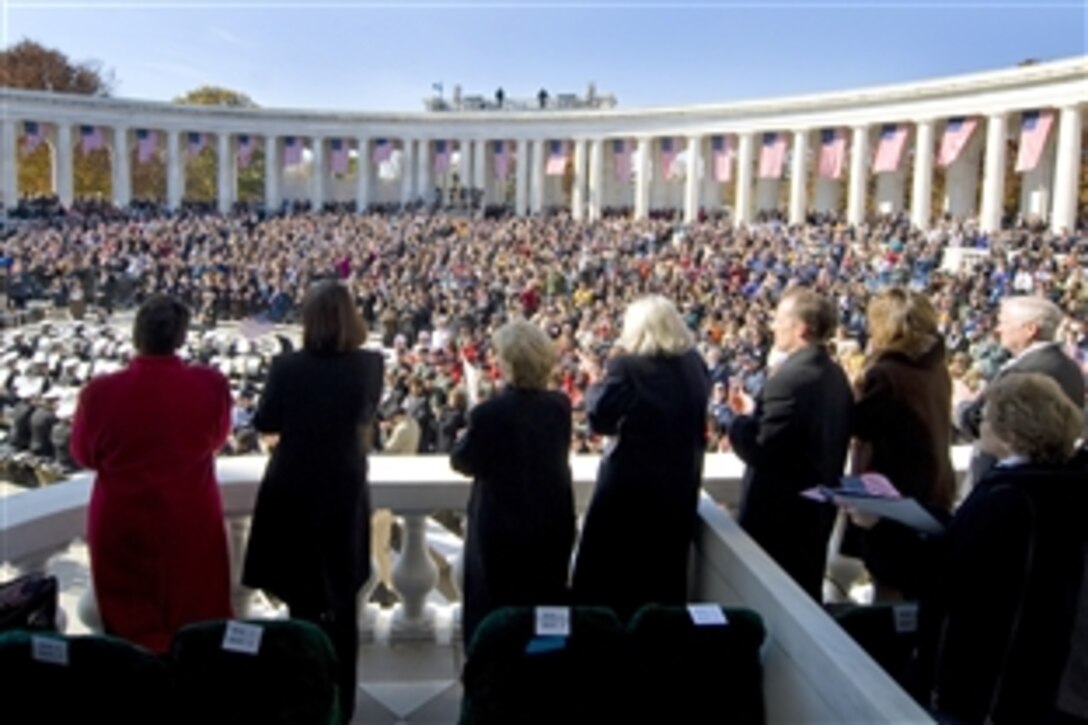 Thousands of people including Defense Secretary Robert M. Gates, right, gather at the Tomb of the Unknown Soldier to attend a Veterans Day ceremony at Arlington National Cemetery, Nov. 11, 2008.  