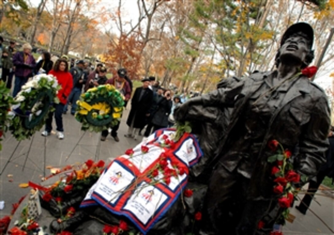 Visitors gather around the Vietnam Women's Memorial as part of the Veteran's Day Observance at the Vietnam Wall in Washington, D.C., Nov. 11, 2008.  The event also marks the 15th Anniversary of the Vietnam Women's Memorial opening.