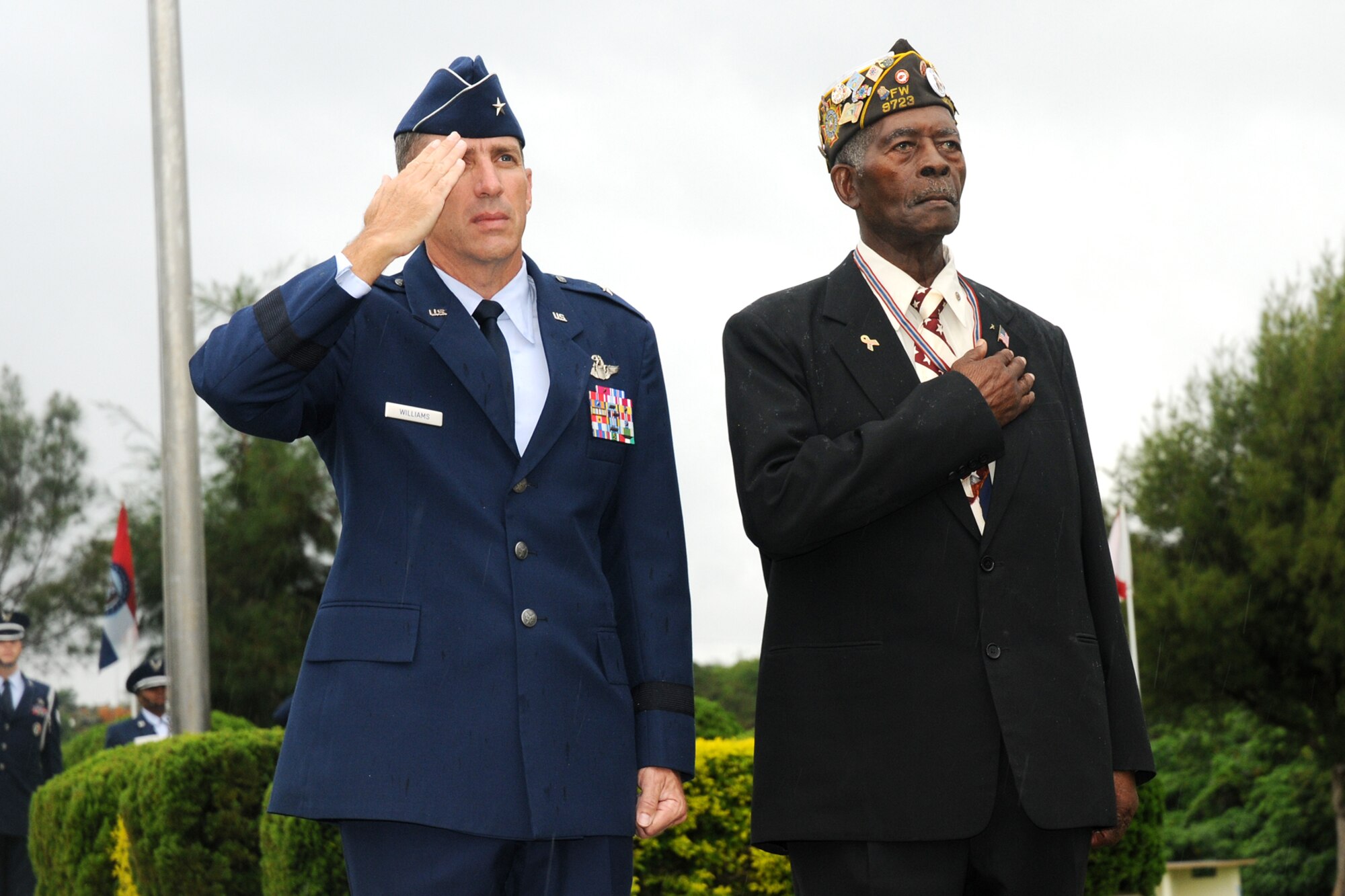 Brig. Gen. Brett T. Williams, 18th Wing commander, and United States Navy
veteran Petty Officer 3rd Class Harry J. Thomas, render courtesies during
the Veteran's Day Ceremony held at Kadena Air Base, Japan Nov. 11, 2008. The
ceremony was held to honor all who have served in defense of the United
States of America. (U.S. Air Force photo/Airman 1st Class Chad Warren)
