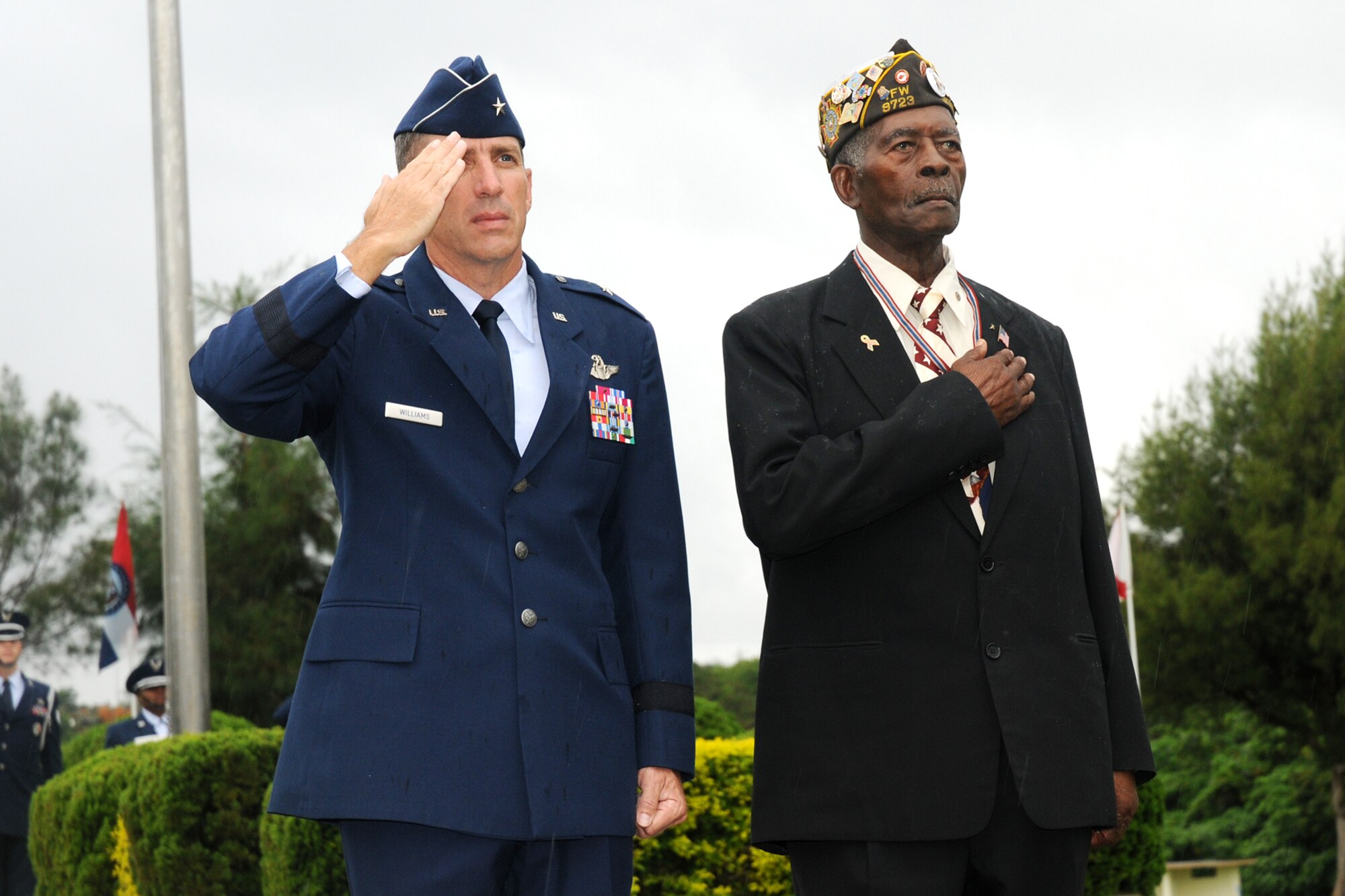 Brig. Gen. Brett T. Williams, 18th Wing commander, and United States Navy
veteran Petty Officer 3rd Class Harry J. Thomas, render courtesies during
the Veteran's Day Ceremony held at Kadena Air Base, Japan Nov. 11, 2008. The
ceremony was held to honor all who have served in defense of the United
States of America. (U.S. Air Force photo/Airman 1st Class Chad Warren)
