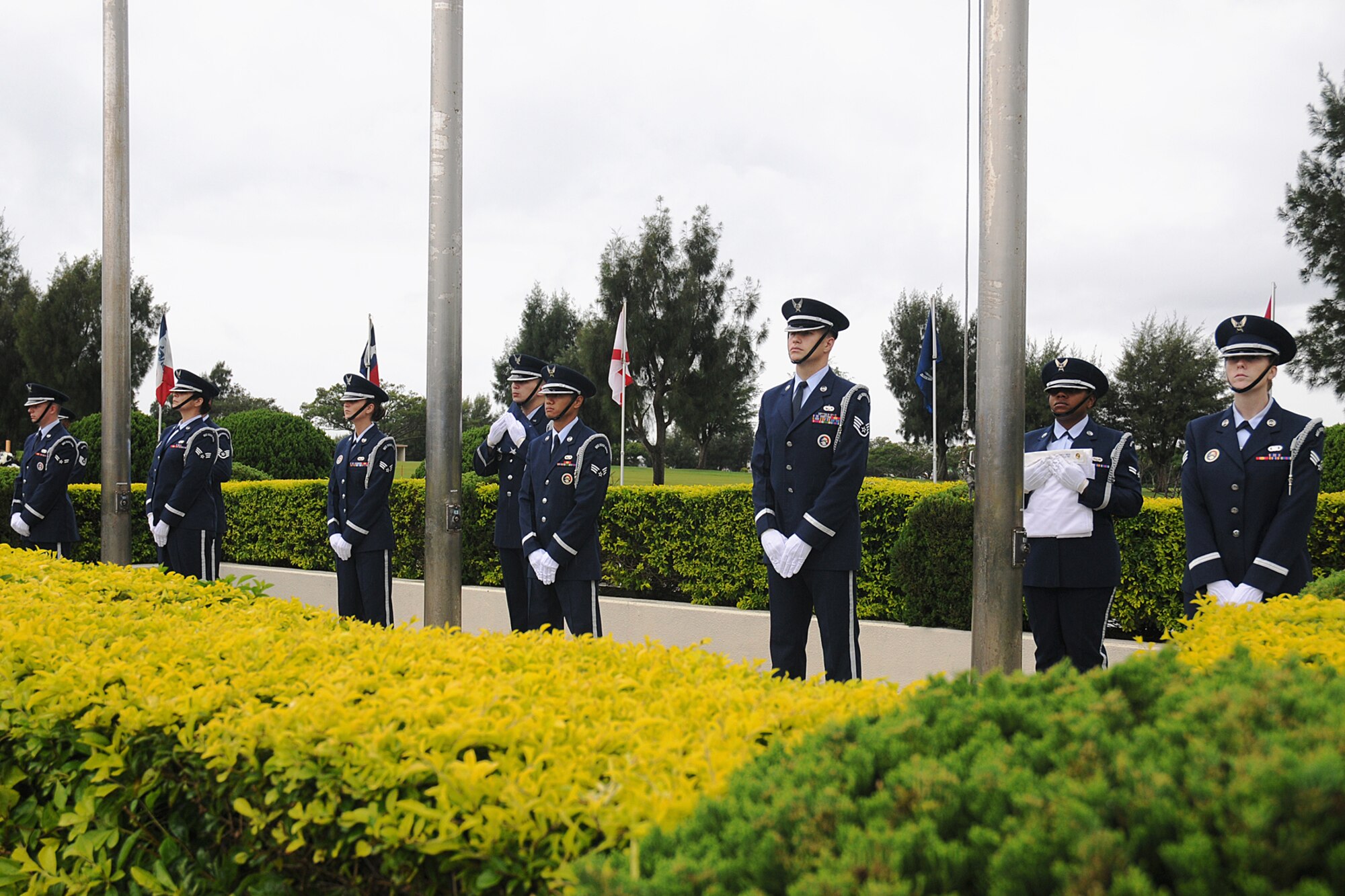 Airmen of the Kadena Air Base Honor Guard prepare to raise the flags during
the Veteran's Day Ceremony held Nov. 11, 2008. The ceremony was held to
honor all who have served in defense of the United States of America. (U.S.
Air Force photo/Airman 1st Class Chad Warren)
