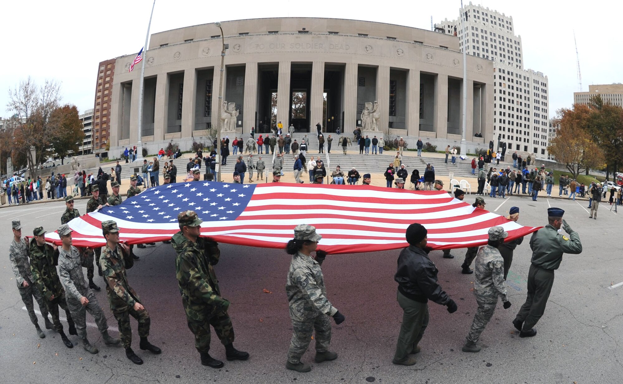 The Air Force Reserve Command Reservists of the 932nd Airlift Wing march the American flag through the streets of Saint Louis during the 2008 Veteran's Day parade.  Reservists come from 33 states to train with the wing located near Belleville, Ill.  Want to join or get more information?  Call 1-800-257-1212 in America.  (U.S. Air Force photo/Tech. Sgt. Gerald Sonnenberg)
