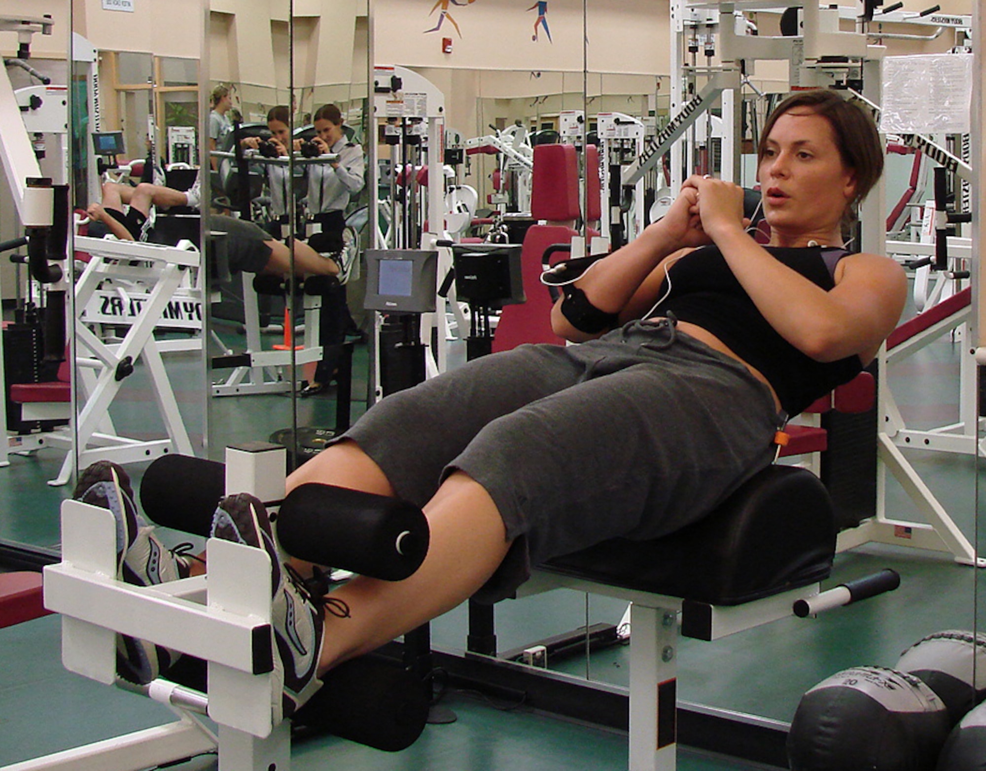 Selena Duffy, aerobics instructor at the Vance Air Force Base Fitness Center, cranks out a set of sit-ups on the center's new equipment. (U.S. Air Force photo by 2nd Lt. Agneta Murnan)