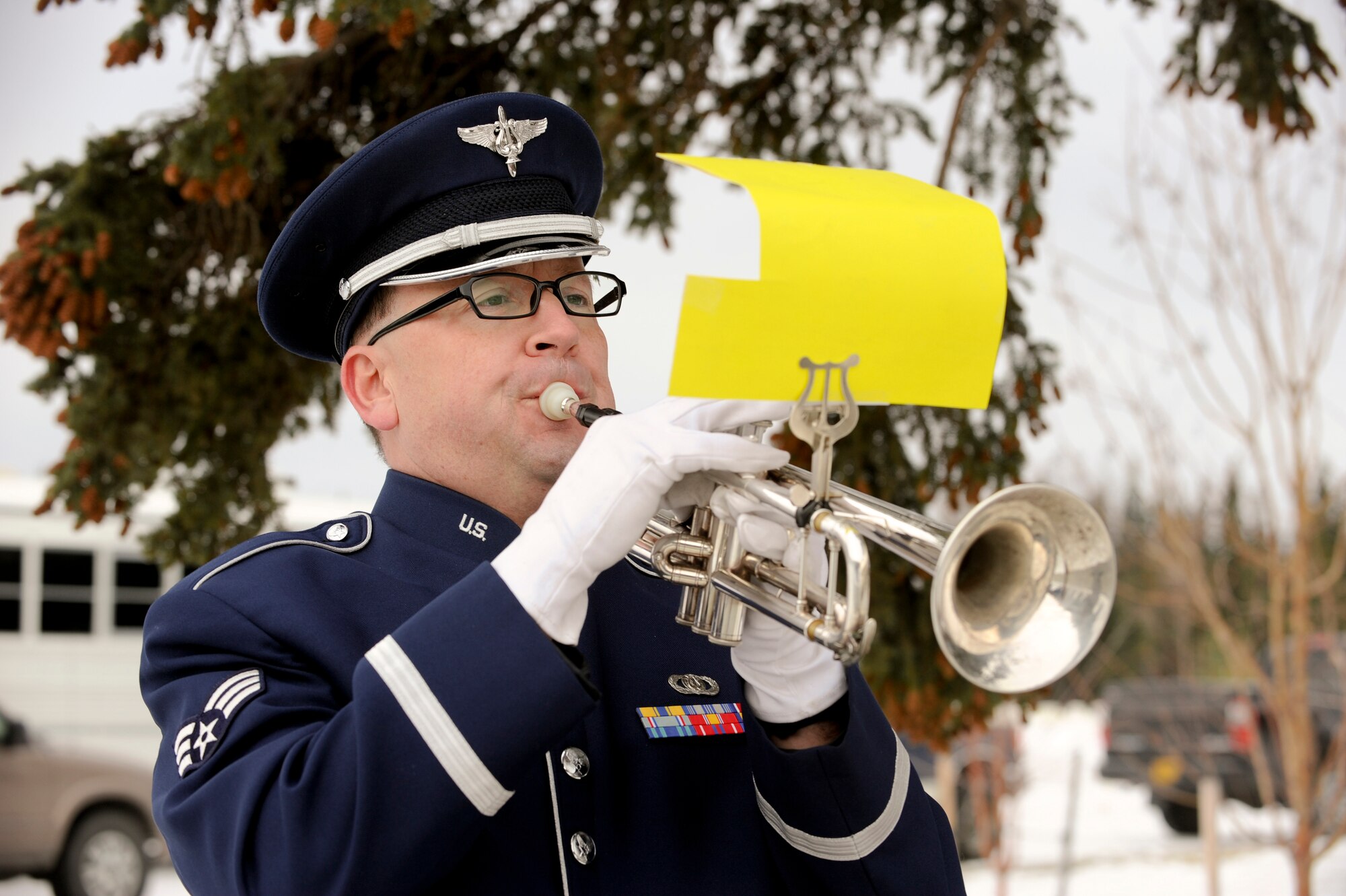 FORT RICHARDSON, Alaska -- Senior Airman Richard McMaster, U.S. Air Force Band of the Pacific, plays taps during the Veterans Day Memorial Ceremony at Fort Richardson Nov. 11. The ceremony held in honor for those veterans who fought in any of the nation's wars consisted of multiple branches of military and the Canadian Air Force. (U.S. Air Force photo/Staff Sgt. Joshua Garcia)