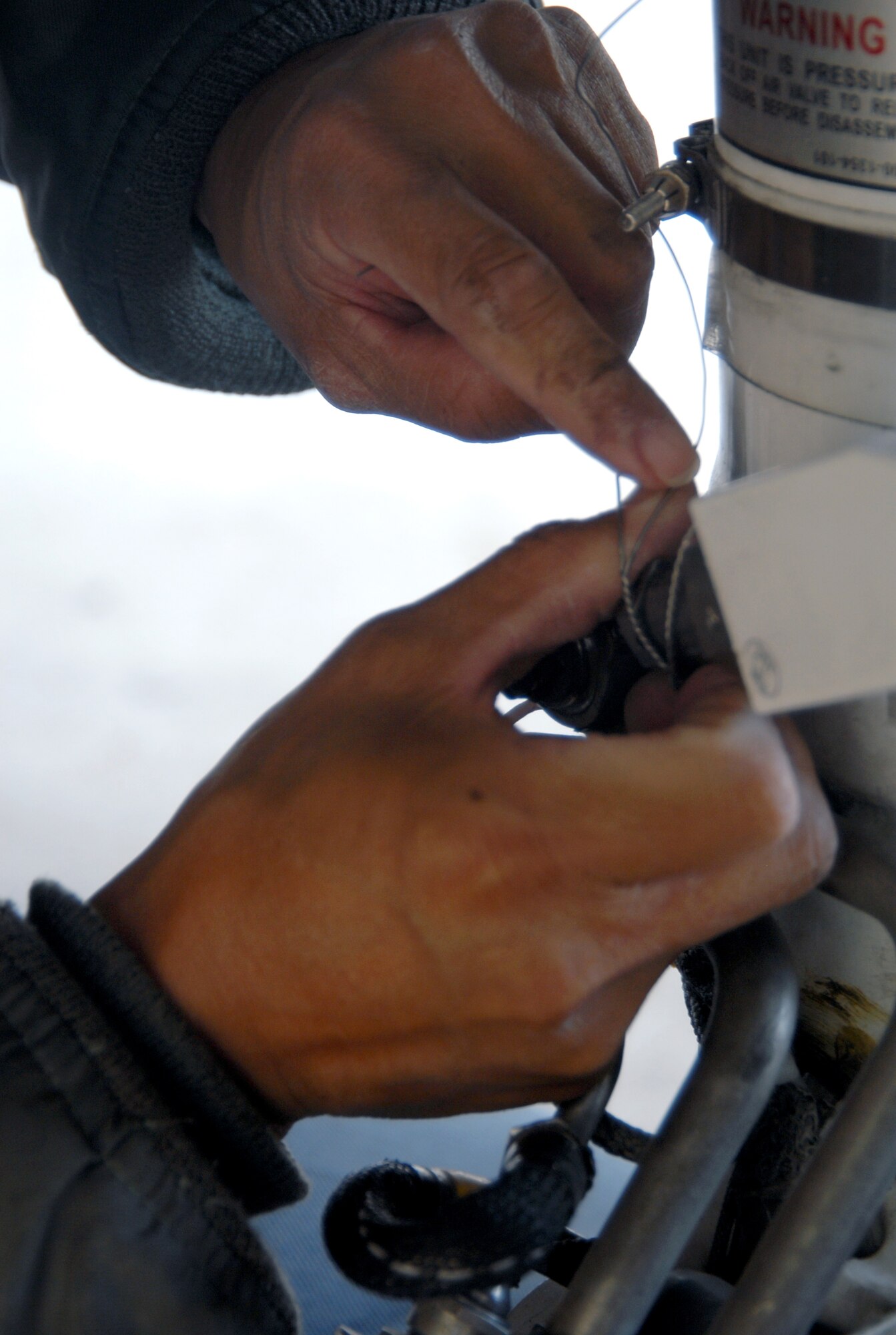 An Airman with the Global Hawk Combined Test Force performs maintenance on a Global Hawk Oct. 24 at Edwards Air Force Base, Calif. (U.S. Air Force photo/Senior Airman Julius Delos Reyes) 
