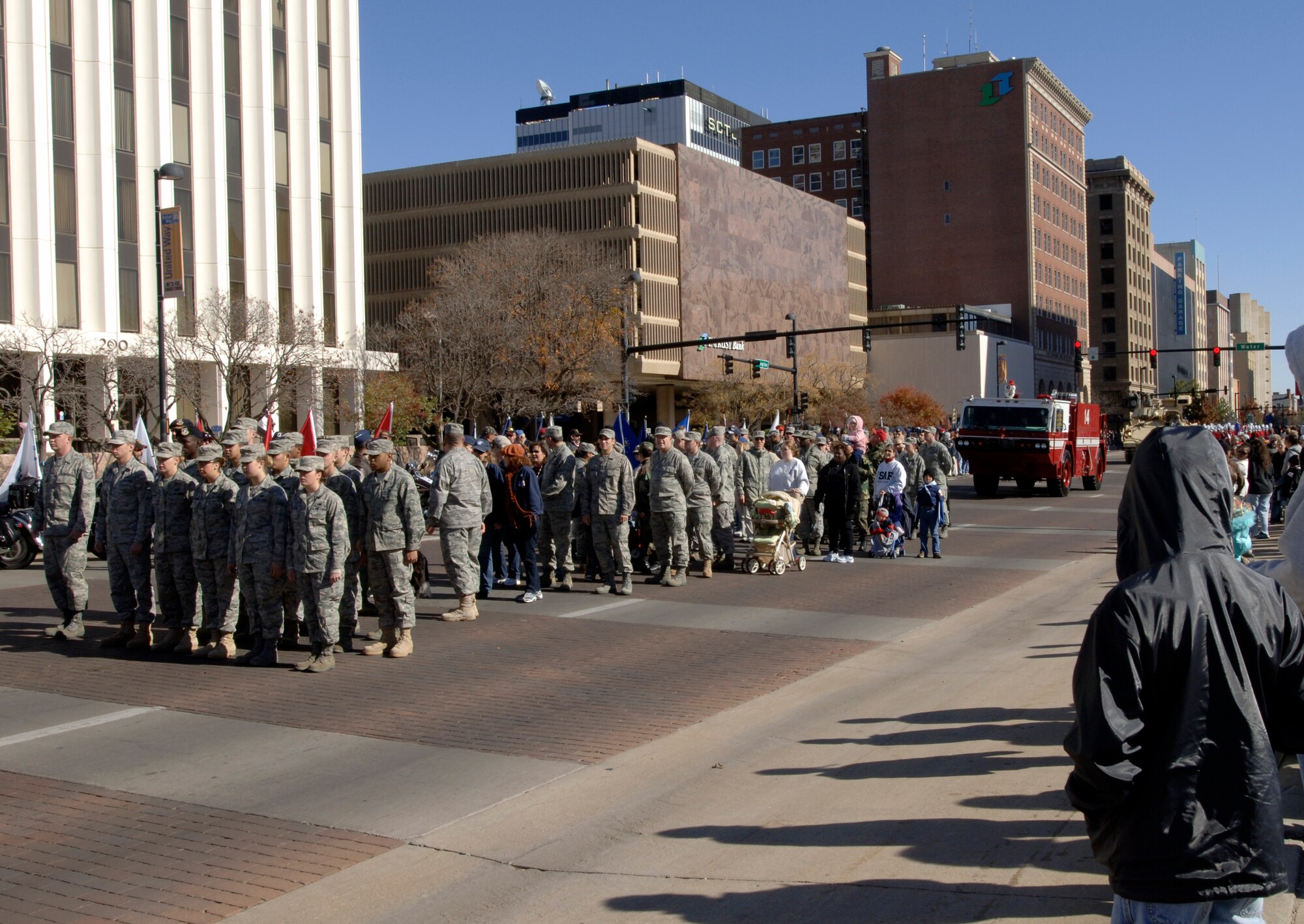 MCCONNELL AIR FORCE BASE, Kan. -- Team McConnell members take part in the Veteran’s Day Parade in downtown Wichita, Kan, Nov. 8. The 22nd Security Forces military working dog demonstration team, base honor guard, and a fire truck from the base’s fire department also participated in the event in remembrance of veterans. (Photo by Senior Airman Laura Suttles)