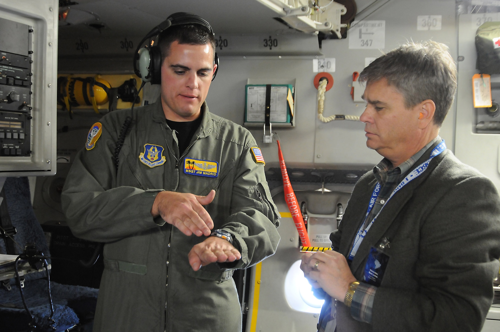 Master Sgt. Jim Madrid explains to Mark Juhas the refueling procedures for a C-17 Globemaster III.  Mr. Juhas, a Los Angeles superior court judge, was among the civic leaders who flew on a C-17 orientation flight Nov. 10 from March Air Reserve Base, Calif. The flight was held as part of events leading up to Air Force Week-Los Angeles activities.  Sergeant Madrid a loadmaster with the 729th Airlift Squadron at March ARB. (U.S. Air Force photo/Joe Juarez)