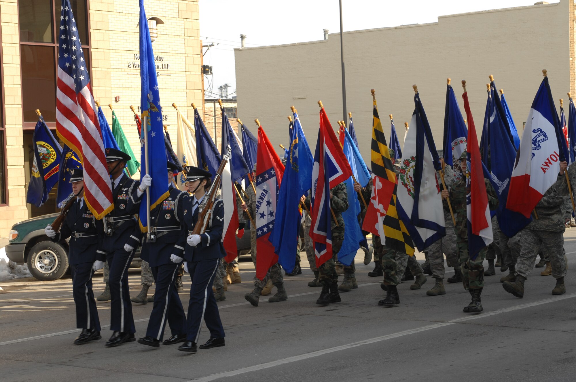 Ellsworth Airmen lead a Veterans Day parade through the streets of downtown Rapid City, S.D., Nov. 11. Veterans Day, originally known as Armistice Day, is annually held Nov. 11 in honor of World War I’s end on the 11th hour of the 11th day of the 11th month in 1918. (U.S. Air Force photo/Airman 1st Class Joshua J. Seybert)