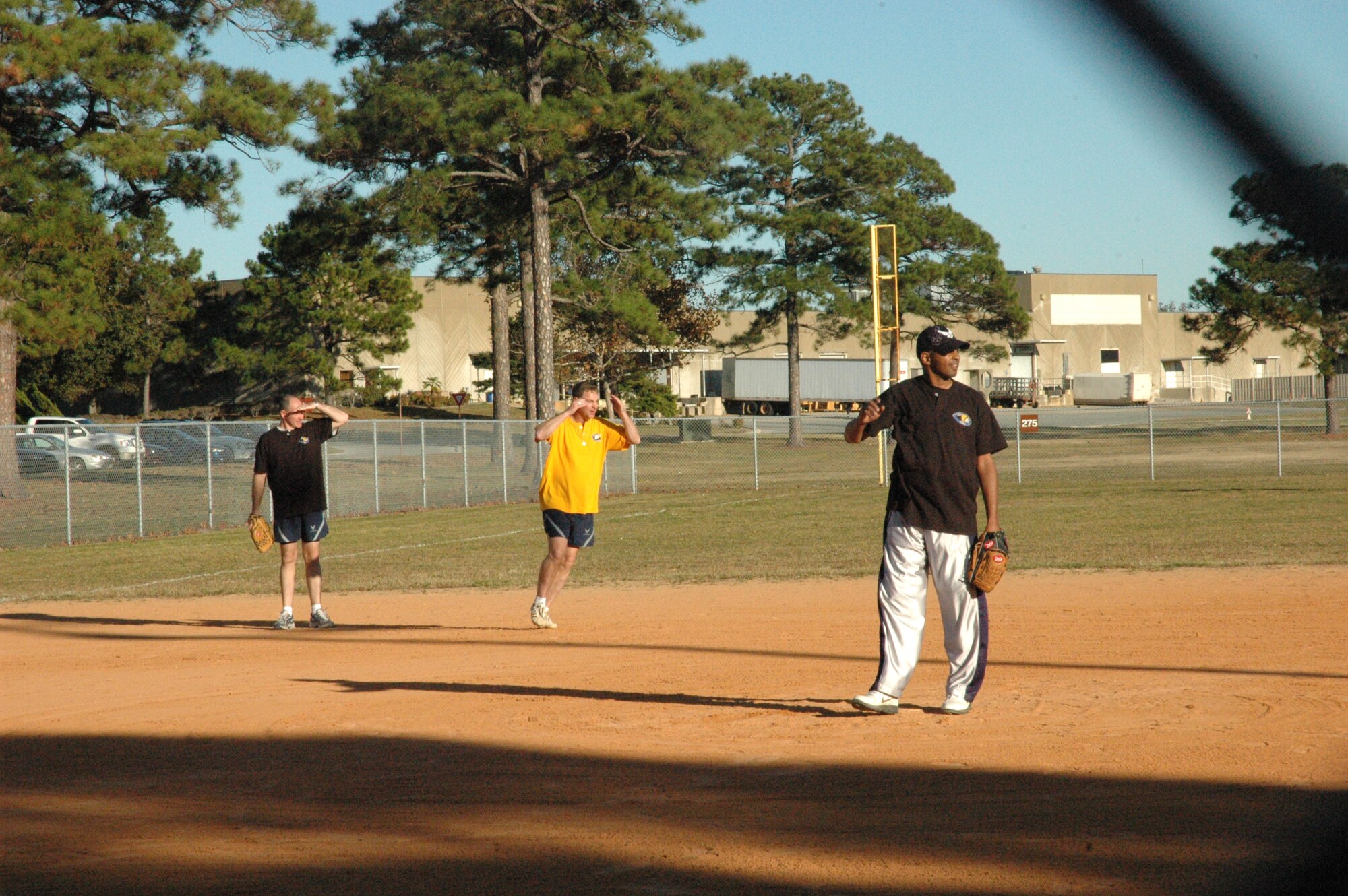 As Col. David Zeh, 325th Mission Support Group commander, approaches third base, a fly ball grabs his attention. The Eagles defeat the Chiefs in a 8-1 victory. (U.S. Air Force photo by Staff Sgt. Vesta M. Anderson)