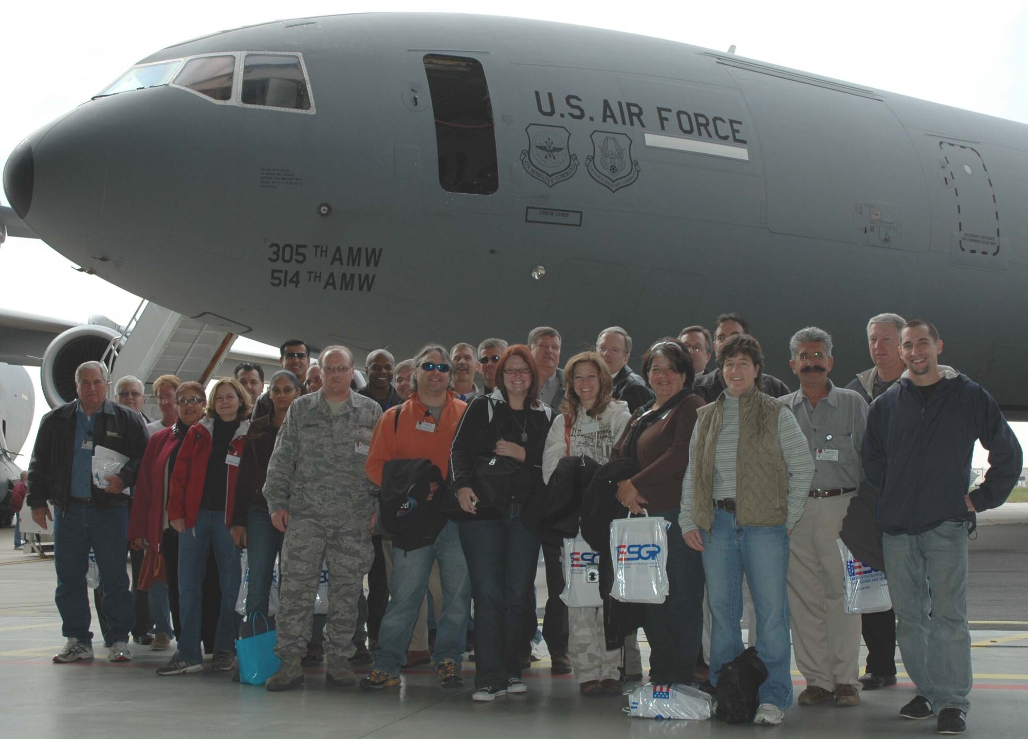 MCGUIRE AIR FORCE BASE, NJ -- Employers of 514th Air Mobility Wing members pose in front of a KC-10 Extender after their flight during the annual Employer Appreciation Day here. More than 100 employers spent the day learning about the military role of their citizen airmen employee. (U.S. Air Force photo/SrA. William P. O'Neil III)