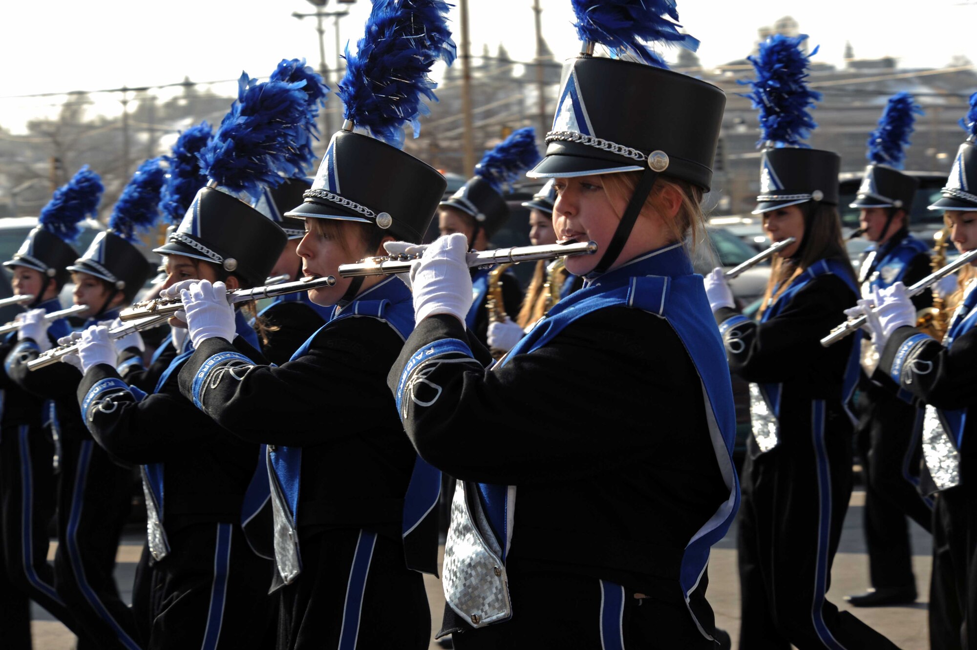 Stevens High School marching band members play flutes during a parade in downtown Rapid City, S.D., Nov. 11. Local school marching bands, boy scout troops and war veterans participated in the parade to show pride and honor for all military members. (U.S. Air Force photo/Airman Corey Hook)