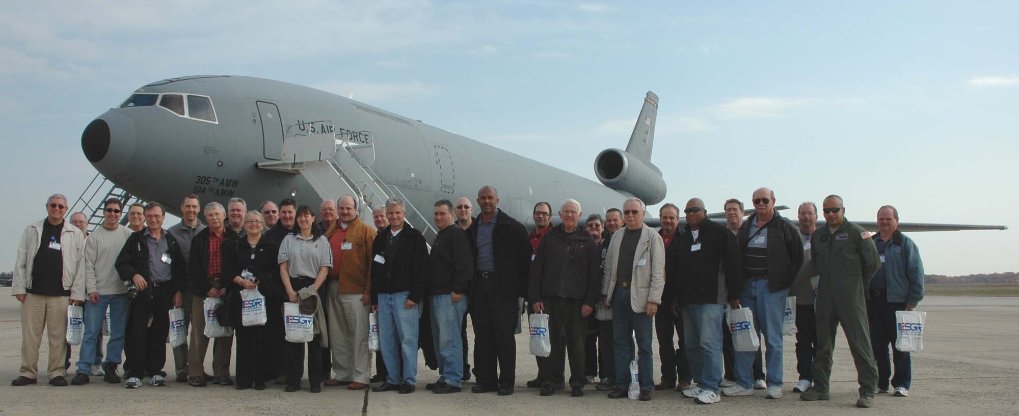 MCGUIRE AIR FORCE BASE, NJ -- Employers of 514th Air Mobility Wing members pose in front of a KC-10 Extender after their flight during the annual Employer Appreciation Day here. More than 100 employers spent the day learning about the military role of their citizen airmen employee. (U.S. Air Force photo/SrA. William P. O'Neil III)