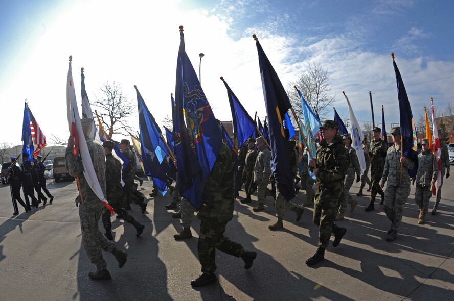 Airmen from the 28th Bomb Wing, Ellsworth Air Force Base, S.D., march with state flags during a parade in downtown Rapid City, S.D., Nov. 11. The annual  Rapid City Veterans Day parade gave thanks to the men and women who have served and who are currently serving in the military. (U.S. Air Force photo/Airman Corey Hook)