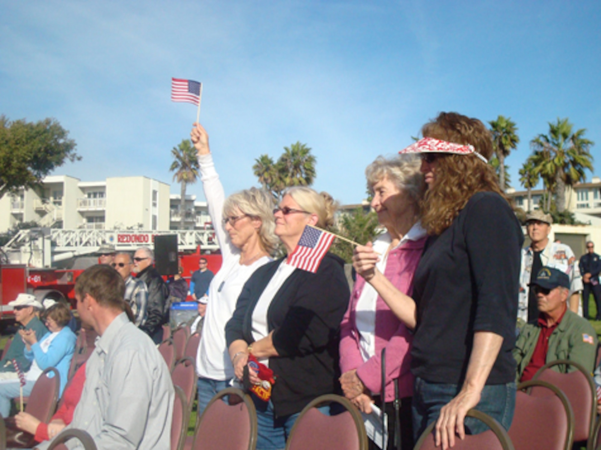 The crowd shows its patriotic spirit at Redondo Beach’s Annual Veterans Day tribute, Nov. 11. Maj. Harold Jackman, GPS Wing, was the keynote speaker at the event. (Photo by Alicia Garges)
