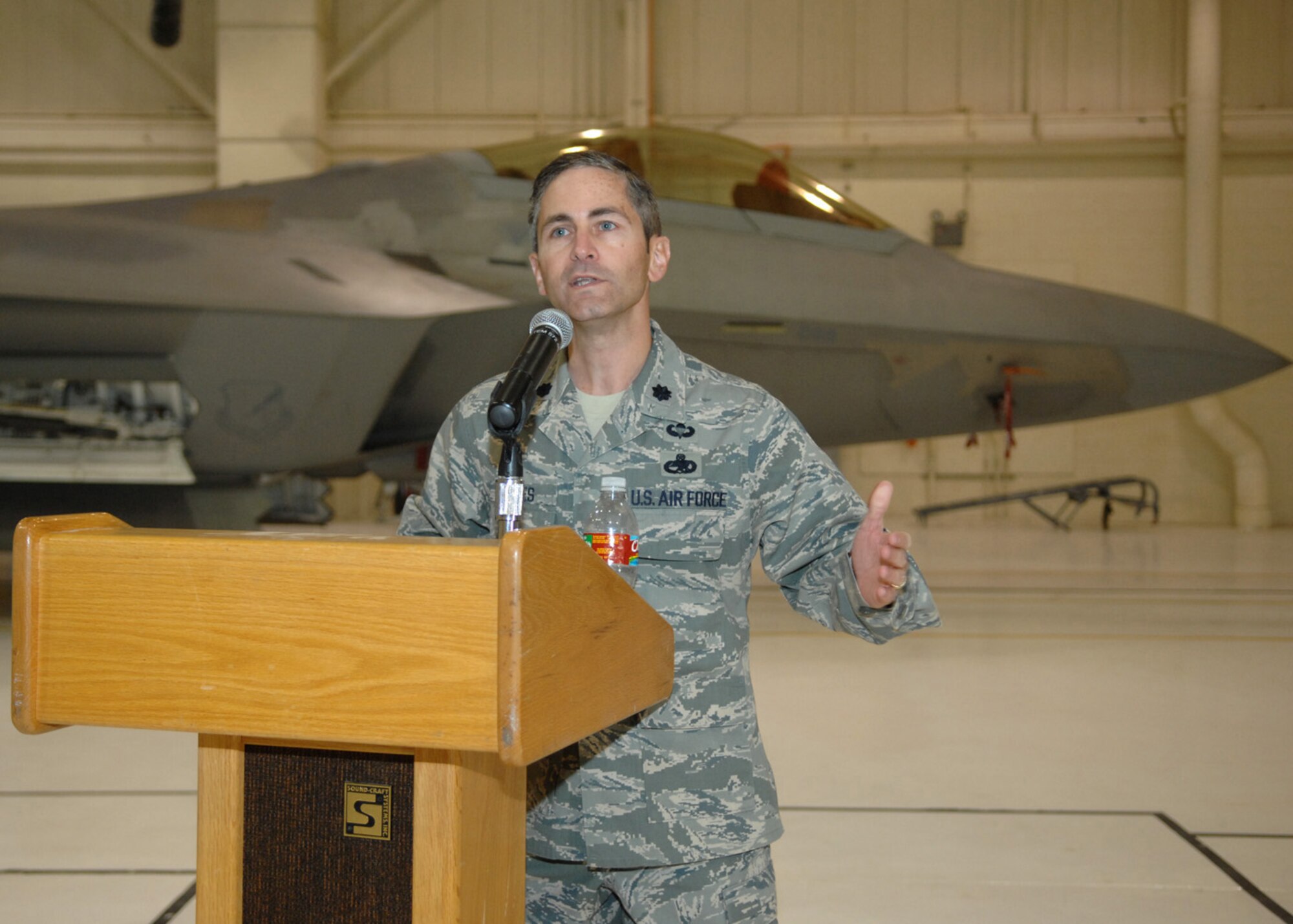 Lt. Col. Steve James, 49th Aircraft Maintenance Squadron commander, describes the roles of six Airmen who were presented the award for Dedicated Crew Chief in hangar bay 2, Nov. 7, at Holloman Air Force Base, N.M. Members who maintained their aircraft with exceptional performance were given the award. (U.S. Air Force photo/Airman 1st Class Veronica Salgado)