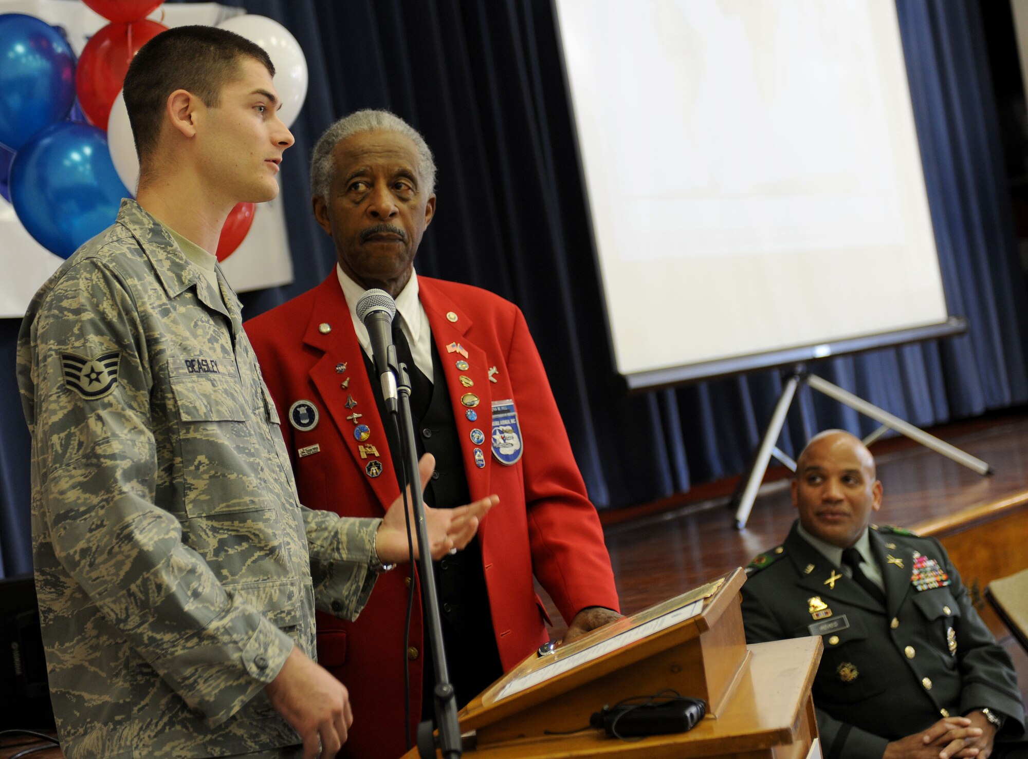 LANGLEY AIR FORCE BASE, Va.-- Staff Sgt. William Beasley, 10th Intelligence Squadron, introduces Ezra M. Hill, Tuskegee Airman, during "Take a Veteran to School Day" at Jane H. Bryan Elementary School Nov. 11. The event gave Hampton school children a chance to meet and honor local service members and veterans. (U.S. Air Force photo/Airman Rebecca Montez)