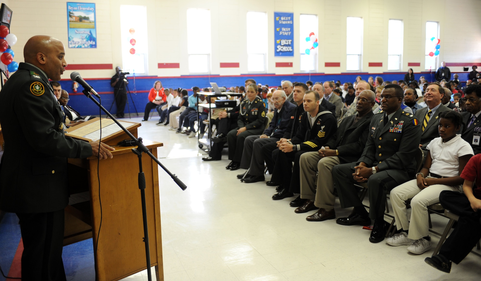 LANGLEY AIR FORCE BASE, Va.-- Col. Anthony D. Reyes, Fort Monroe post commander, speaks to elementary school children, servicemembers and veterans during "Take a Veteran to School Day" at Jane H. Bryan Elementary School Nov. 11. The event gave Hampton school children a chance to meet and honor local servicemembers and veterans. (U.S. Air Force photo/Airman Rebecca Montez)