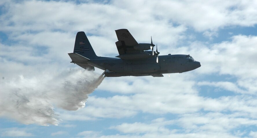 A C-130H delivers a powerful blast of water Nov. 12 during a modular airborne firefighting system, or 'MAFFS' demonstration in Lincoln County, Colo. The demonstration was part of an up-close look of the 302nd Airlift Wing during a visit with Lt. Gen. Charles Stenner, Jr., commander of Air Force Reserve Command. (U.S. Air Force photo/Senior Airman Stephen Collier)