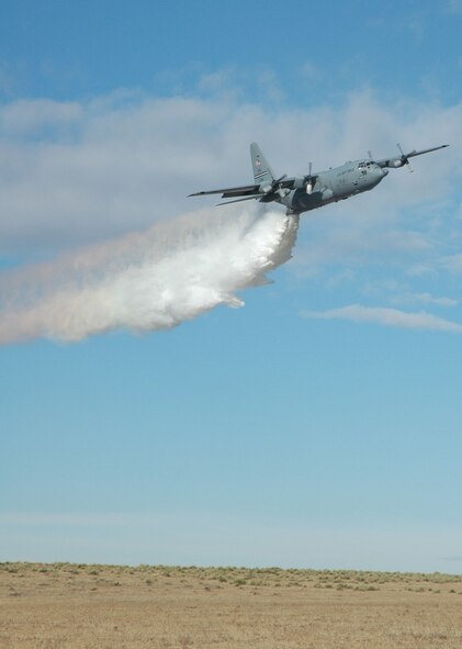A C-130H delivers a powerful blast of water Nov. 12 during a modular airborne firefighting system, or 'MAFFS' demonstration in Lincoln County, Colo. The demonstration was part of an up-close look of the 302nd Airlift Wing during a visit with Lt. Gen. Charles Stenner, Jr., commander of Air Force Reserve Command. (U.S. Air Force photo/Senior Airman Stephen Collier)