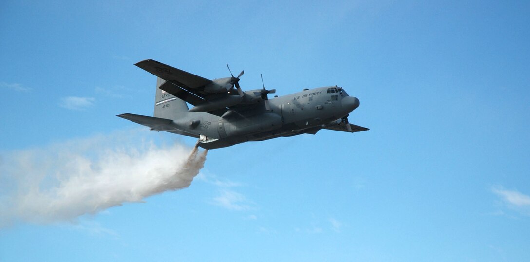 A C-130H delivers a powerful blast of water Nov. 12 during a modular airborne firefighting system, or 'MAFFS' demonstration in Lincoln County, Colo. The demonstration was part of an up-close look of the 302nd Airlift Wing during a visit with Lt. Gen. Charles Stenner, Jr., commander of Air Force Reserve Command. (U.S. Air Force photo/Senior Airman Stephen Collier)