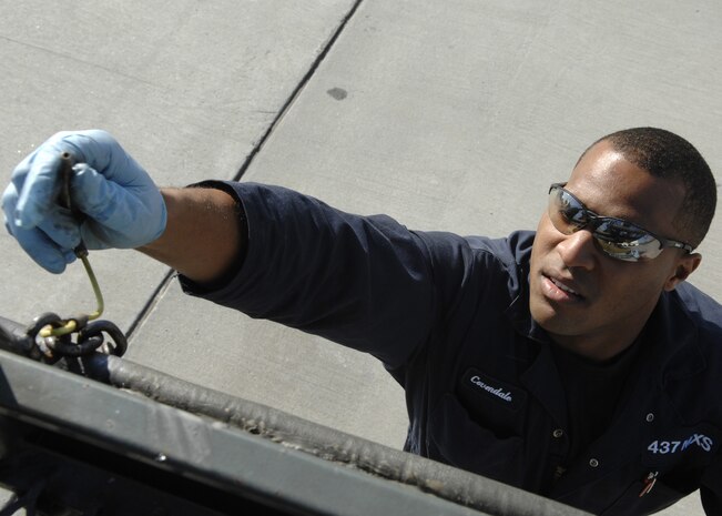 Airman 1st Class Kyle Coverdale lubricates safety pins on a B-7 maintenance stand Nov. 12 at the aerospace ground equipment shop on Charleston AFB. AGE Airmen routinely perform preventive maintenance inspections on flightline equipment to make sure they are operable and safe. Airman Coverdale is with the 437th Maintenance Squadron. (U.S. Air Force photo/Airman 1st Class Katie Gieratz)