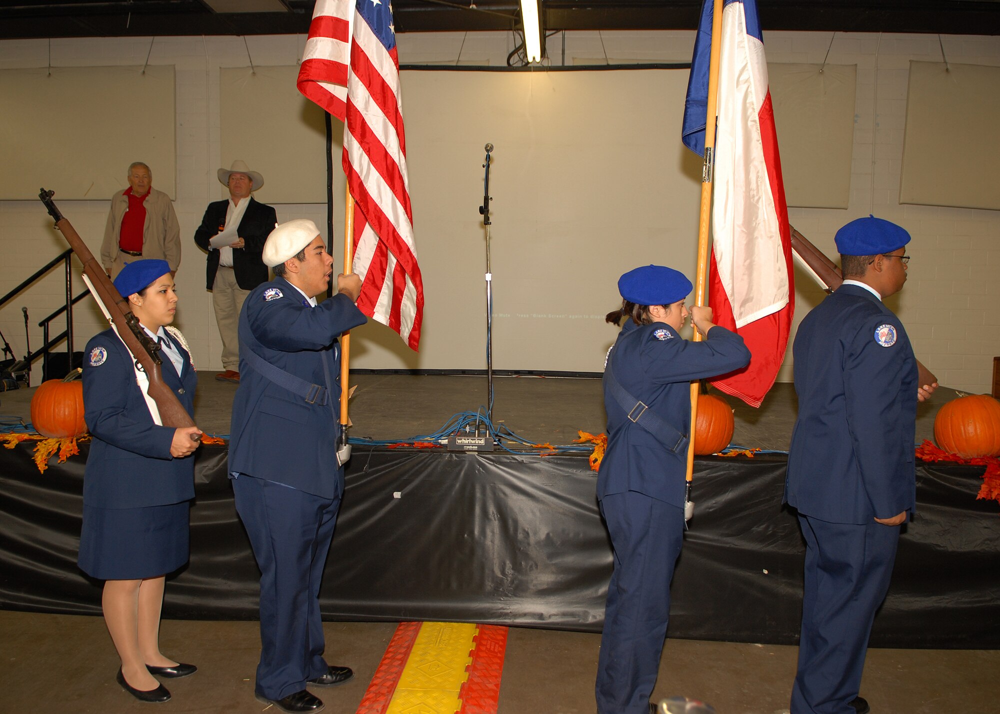 Members of the Lake View High School Junior Reserve Officer Training Corps finish posting the colors at the annual H-E-B Feast of Sharing at the Wells fargo Pavilion in San Angelo on Nov. 9.  (U.S. Air Force photo by Senior Airman Kasabyan Musal).