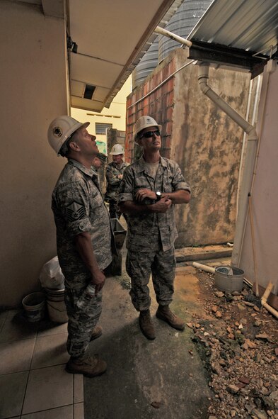 TUNAPUNA, Trinidad and Tobago -- Master Sgts. Robert Chandler and Ray Bedwell, both of the 5th Civil Engineer Squadron currently embarked aboard USS Kearsarge (LHD 3), conduct a site survey before beginning engineering operations at Cyril Ross Nursery as part of the partnership between Continuing Promise 2008 and Trinidad-Tobago. CP 2008 is a collaborative effort between the United States and partner militaries, non-governmental organizations, and partner-nation support organizations to build strong partnerships that can be called upon in the event of a regional situation requiring cooperative solutions. (U.S. Navy photo by Mass Communication Specialist 3rd Class (SW) David Danals)