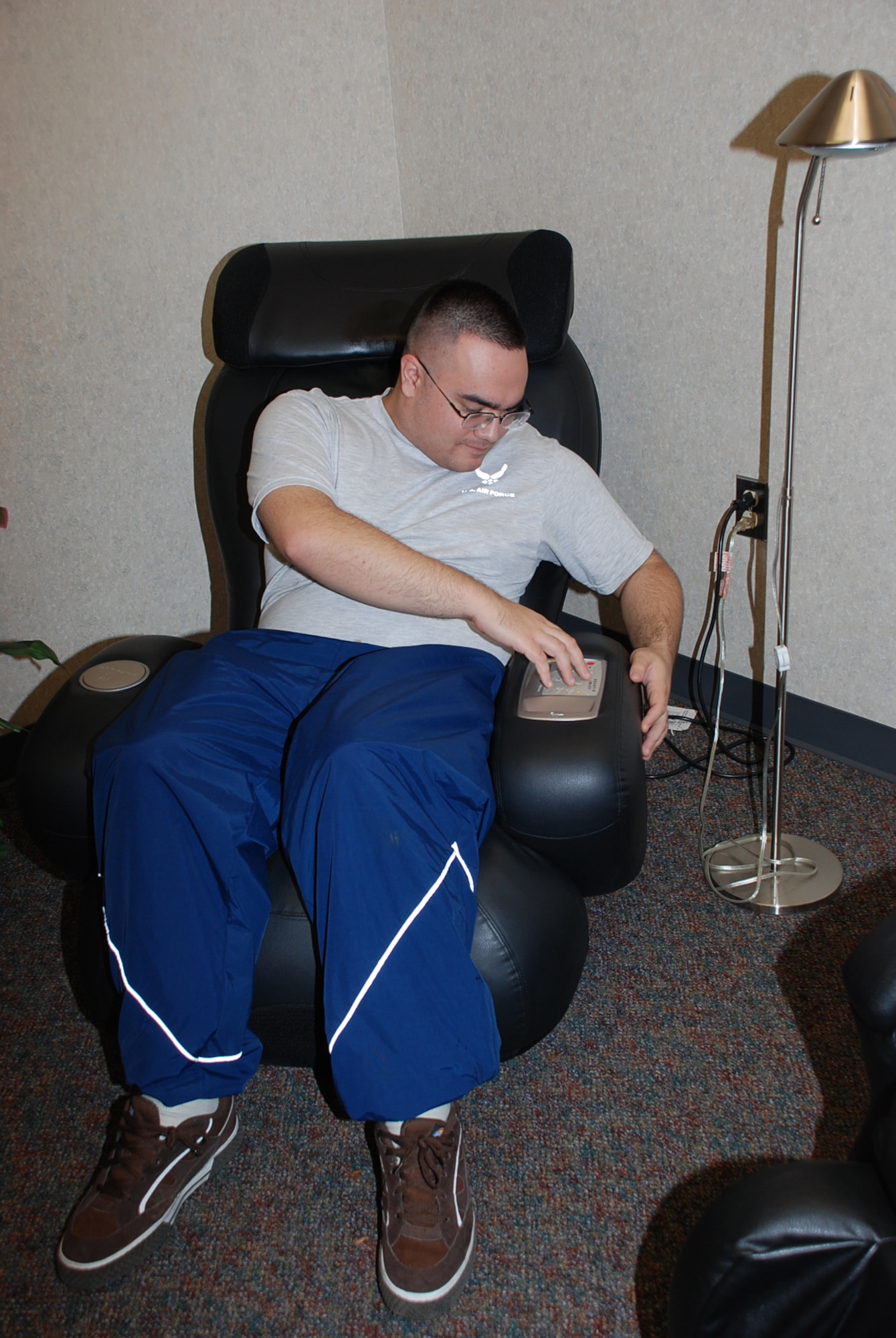 Senior Airman Louis Leskovar, 605th AMXS, checks out a massage chair at the Health and Wellness Center recently. The HAWC has a relaxation room, which features two massage chairs and stress-relieving music for Airmen, family members and retirees to use throughout the duty day. (U.S. Air Force photo/Airman 1st Class Bekah Phy)