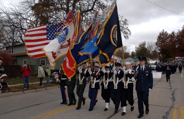 OFFUTT AIR FORCE BASE, Neb. - A military color guard marches down Mission Avenue in Olde Towne Bellevue, Neb., to kickstart the 8th annual Veterans Day Parade, Nov 8.  More than 400 Offutt members marched in the parade representing U.S. Strategic Command, 55th Wing, Air Force Weather Agency, and several other units.

U.S. Air Force Photo by Josh Plueger