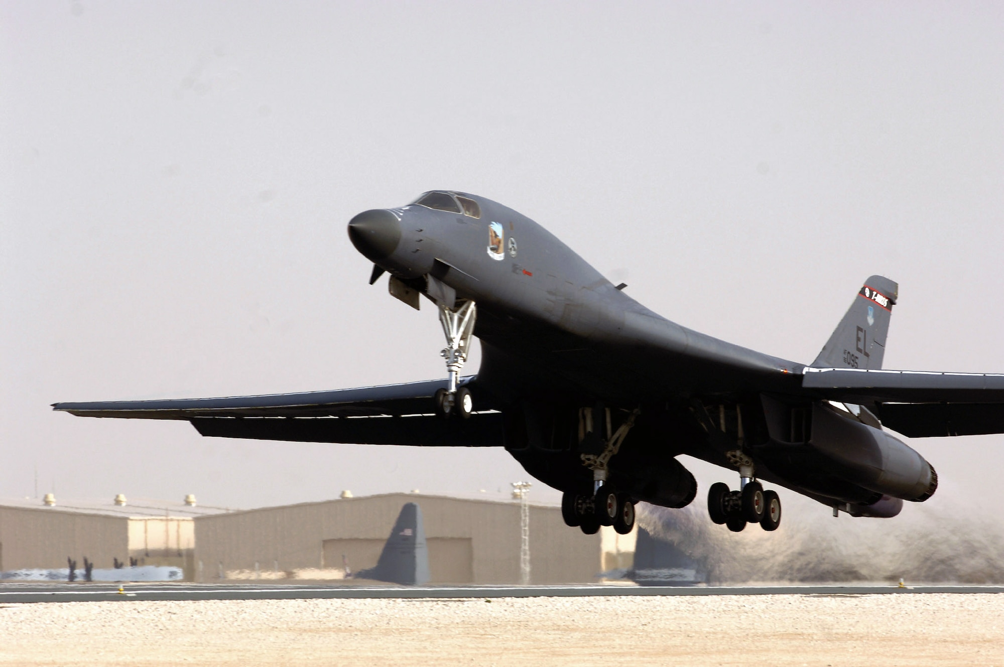 A B-1B Lancer takes off from a base in Southwest Asia to support Operations Enduring and Iraqi Freedom. The B-1B has the capability to carry guided and unguided weapons and deliver massive quantities of precision and non-precision weapons against specific targets. (U.S. Air Force photo)