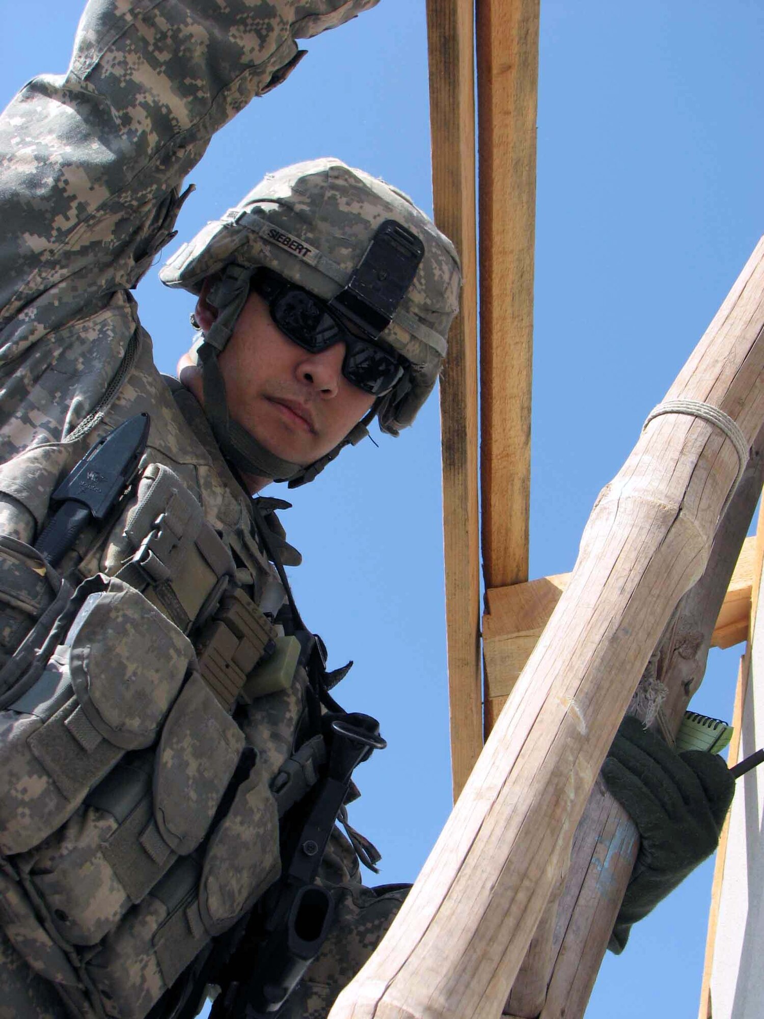 Capt. Michael Siebert inspects the roof of a veterinarian clinic Nov. 3 in Jalalabad City, Afghanistan. He is part of the Nangarhar Provincial Reconstruction Team that is made up of Airmen and Soldiers from around the world and charged with assisting the provincial government in improving security, governance and reconstruction. (U.S. Air Force photo/Capt. J. Elaine Hunnicutt) 

