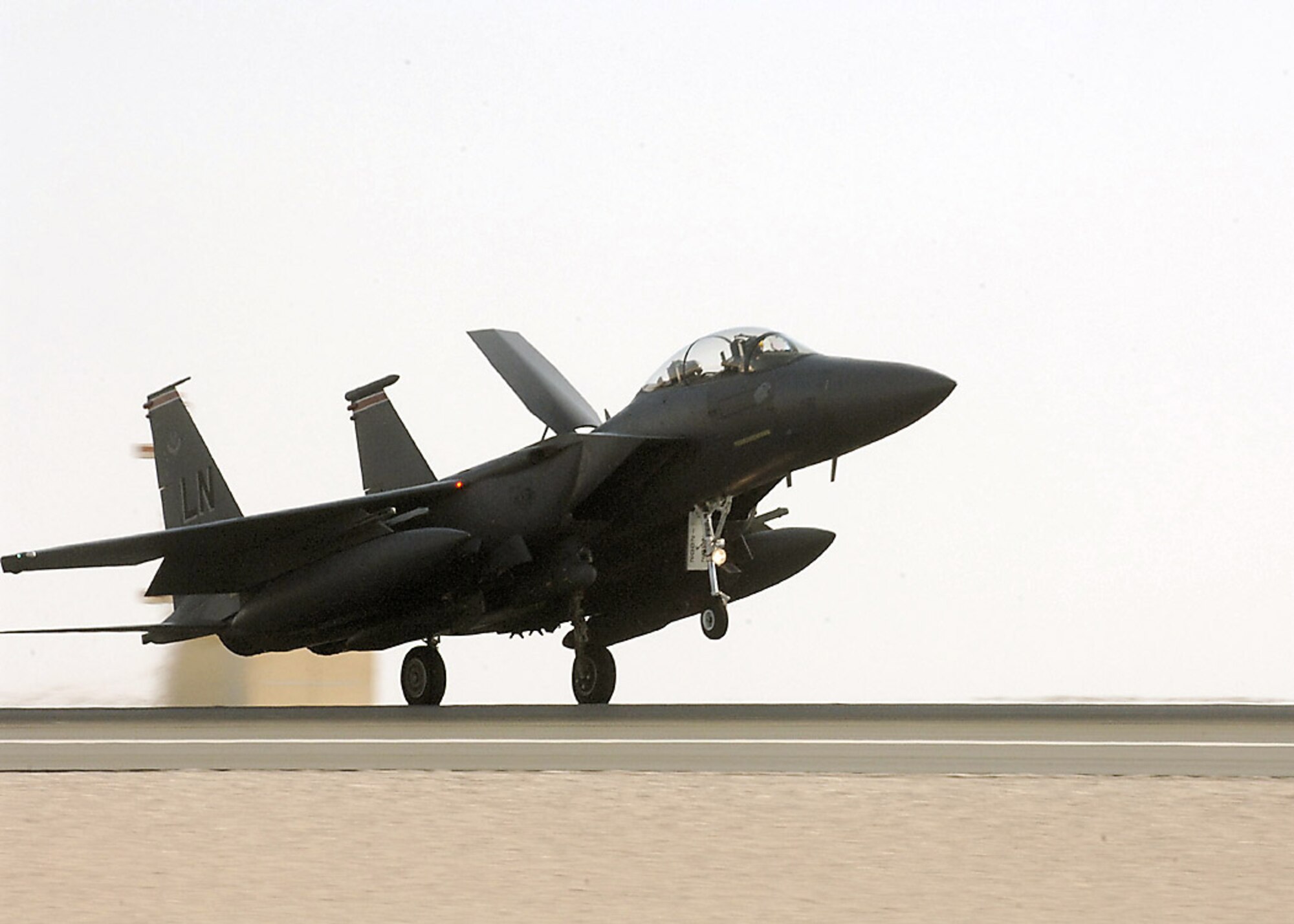 An F-15E Strike Eagle lands after a mission in Southwest Asia. The F-15Es and other coalition aircraft flew 115 close-air-support missions in Iraq and Afghanistan Nov. 10. (U.S. Air Force photo)