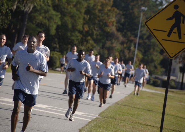 Team Charleston members pace themselves as they near the three-quarter mark of the Commander's Fitness Challenge on Charleston AFB Nov. 7. More than 400 Airmen from various squadrons came out to participate in the monthly challenge. (U.S. Air Force photo/Senior Airman Timothy Taylor)