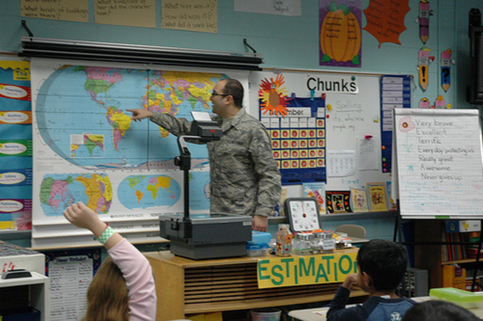 SEYMOUR JOHNSON AIR FORCE BASE, N.C. -- Tech. Sgt. Adam Palmese, a Reservist with the 916th Communications Squadron, talks to second graders at Davis Drive Elementary School in Cary, NC on Nov. 11, 2008. Sgt. Palmese showed students where  reservists had deployed on a world map and took questions from the students who were eager to share Veteran's Day learning about the military and the Air Force Reserve. Sgt. Palmese was not only supporting his wife, who is the class's teacher, but he was also supporting the 916th Air Refueling Wing's Human Resource Development Council's mission of community outreach and education.