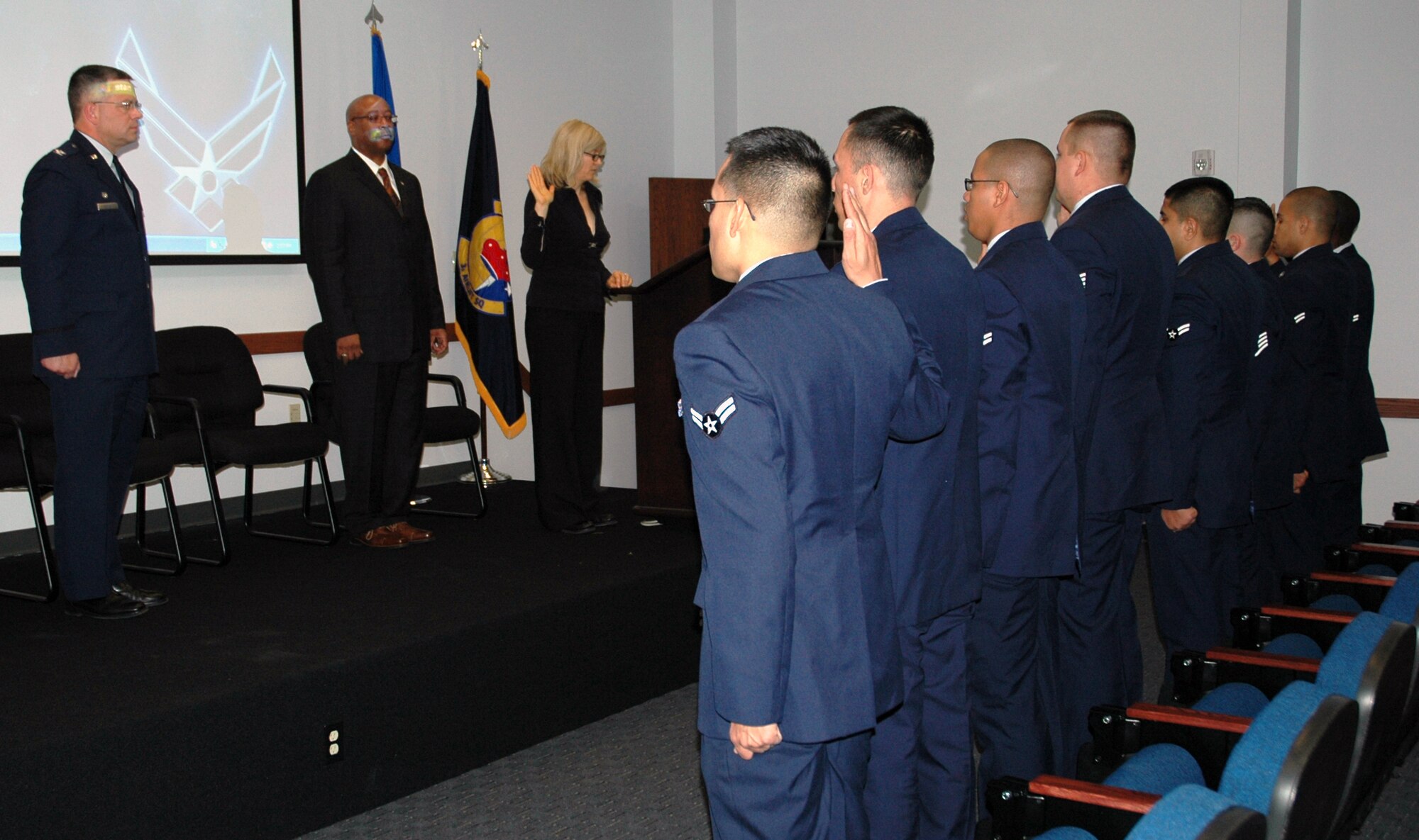 DOVER AIR FORCE BASE, Del. -- Eight 436th Airlift Wing Airmen, who hailed from seven countries, raised their right hands and said the Oath of Allegiance during the Military Naturalization Ceremony here Nov. 11. Col. Randal L. Bright, 512th Airlift Wing commander, addressed the nation's newest citizens commending them for their service. (U.S. Air Force photo/Capt. Marnee A.C. Losurdo)