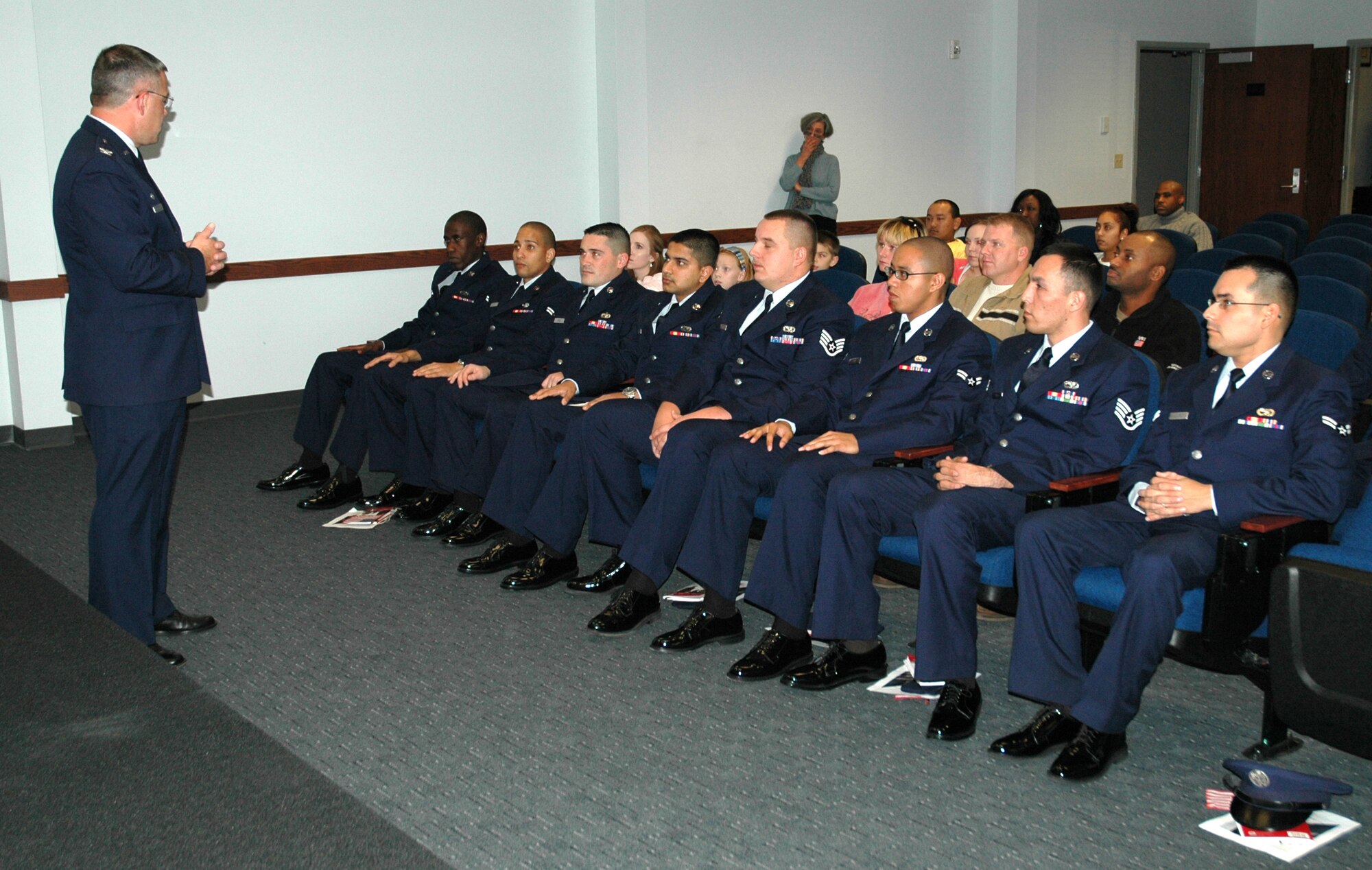 DOVER AIR FORCE BASE, Del. -- 512th Airlift Wing Commander Col. Randal L. Bright addresses eight of America's newest citizens on Veterans Day, Nov. 11. Eight 436th Airlift Wing Airmen, who hailed from seven countries, raised their right hands and said the Oath of Allegiance during the Military Naturalization Ceremony here.(U.S. Air Force photo/Capt. Marnee A.C. Losurdo)