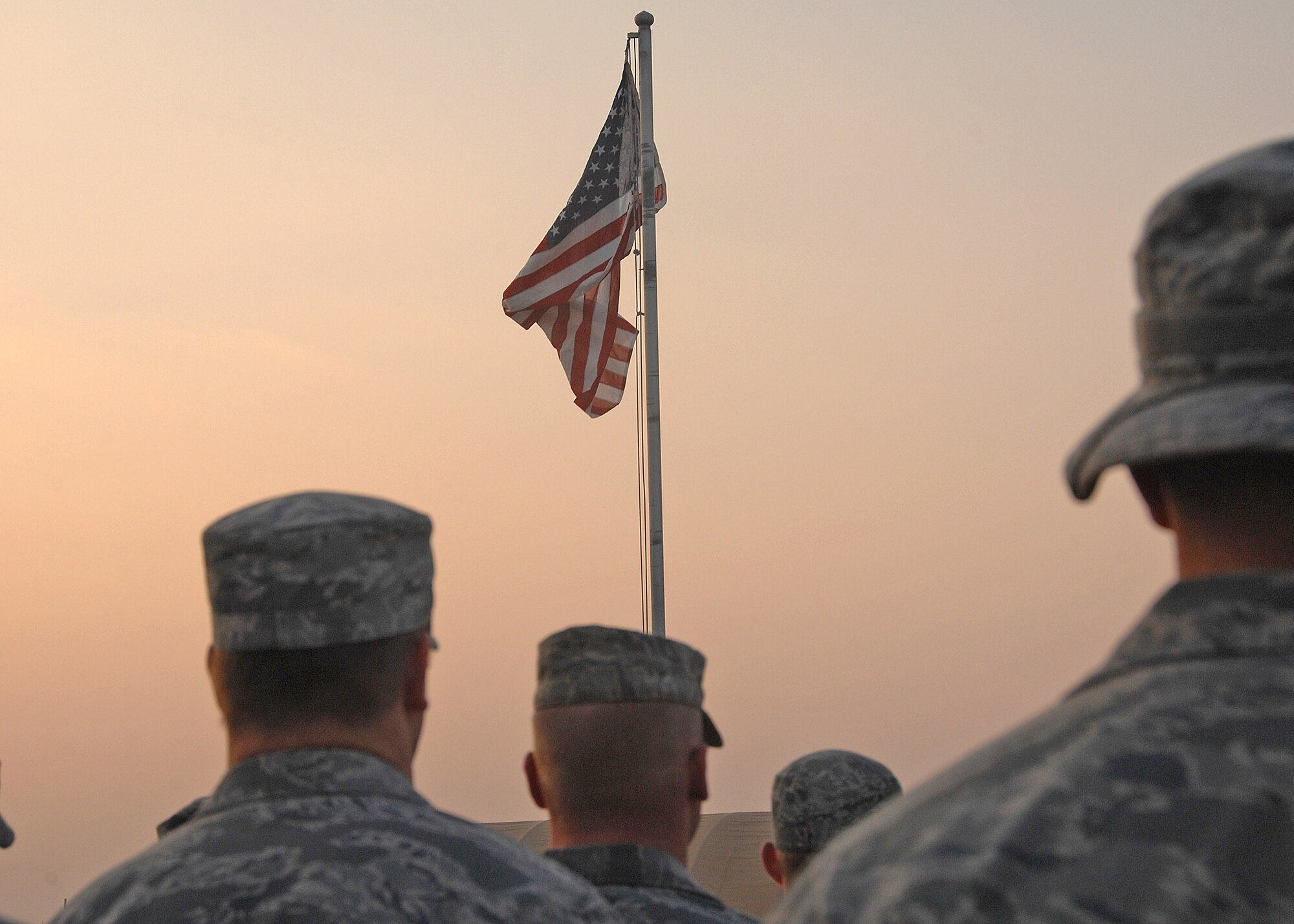 Members of the 387th Air Expeditionary Group stand in formation during the Veterans Day Reveille Ceremony Nov. 11 at an air base in Southwest Asia. (U.S. Air Force photo/Tech. Sgt. Raheem Moore) 
