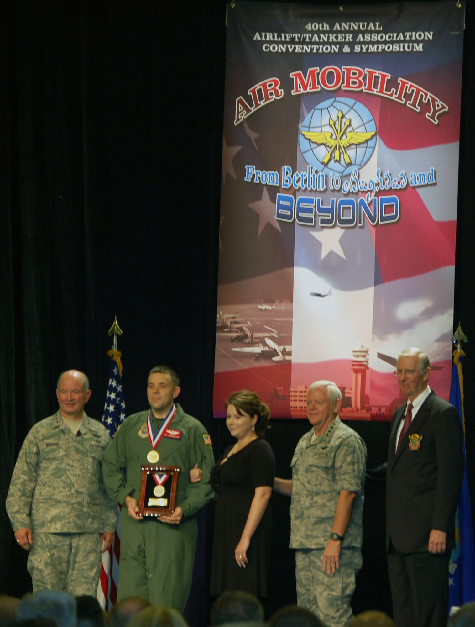 Tech. Sgt. Jeremiah Love (second from left), from the 618th Tanker Airlift Control Center at Scott Air Force Base, Il.., and formerly with the 32nd Air Refueling Squadron at McGuire Air Force Base, N.J., holds 2008 Airlift/Tanker Association Young Leadership Award he received during an awards presentation at the 2008 A/TA convention in Anaheim, Calif., Nov. 7.  With Sergeant Love in the photo are Gen. Duncan McNabb, U.S. Transportation Command commander, his wife Laura, Gen. Arthur Lichte, Air Mobility Command commander, and retired Gen. Walter Kross, current A/TA chairman and former AMC commander.  Sergeant Love is a KC-10 evaluator in-flight refueling operator and was nominated for the award when he was at McGuire.  (U.S. Air Force Photo/Tech. Sgt. Scott T. Sturkol)