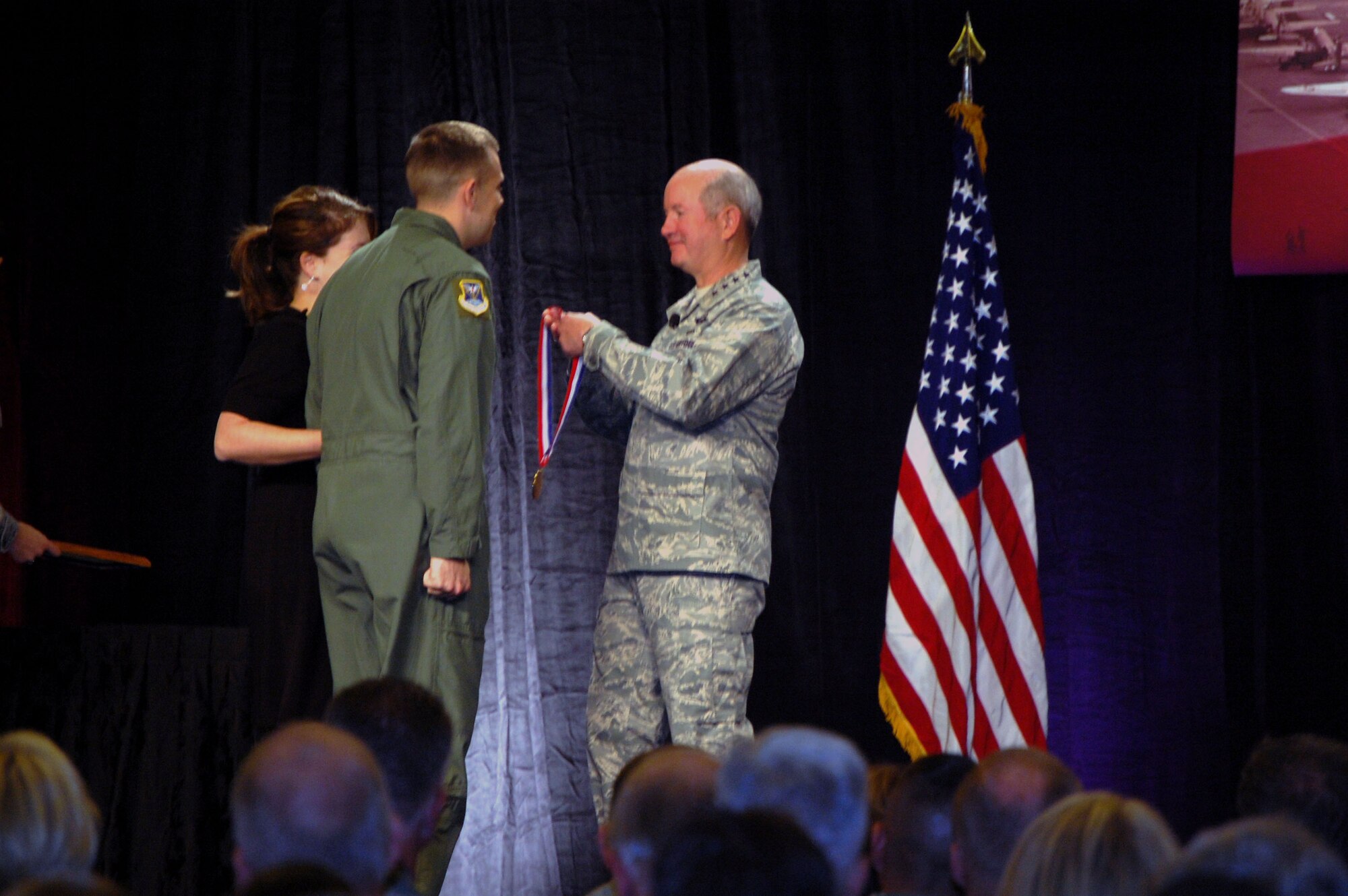 Tech. Sgt. Jeremiah Love, from the 618th Tanker Airlift Control Center at Scott Air Force Base, Ill., and formerly with the 32nd Air Refueling Squadron at McGuire AFB, N.J., receives the 2008 Airlift/Tanker Association Young Leadership Award medal from Gen. Duncan McNabb, U.S. Transportation Command commander, during an awards presentation at the 2008 A/TA convention in Anaheim, Calif., Nov. 7.  Sergeant Love is a KC-10 evaluator in-flight refueling operator who was nominated for the award while stationed at McGuire.  (U.S. Air Force Photo/Tech. Sgt. Scott T. Sturkol)