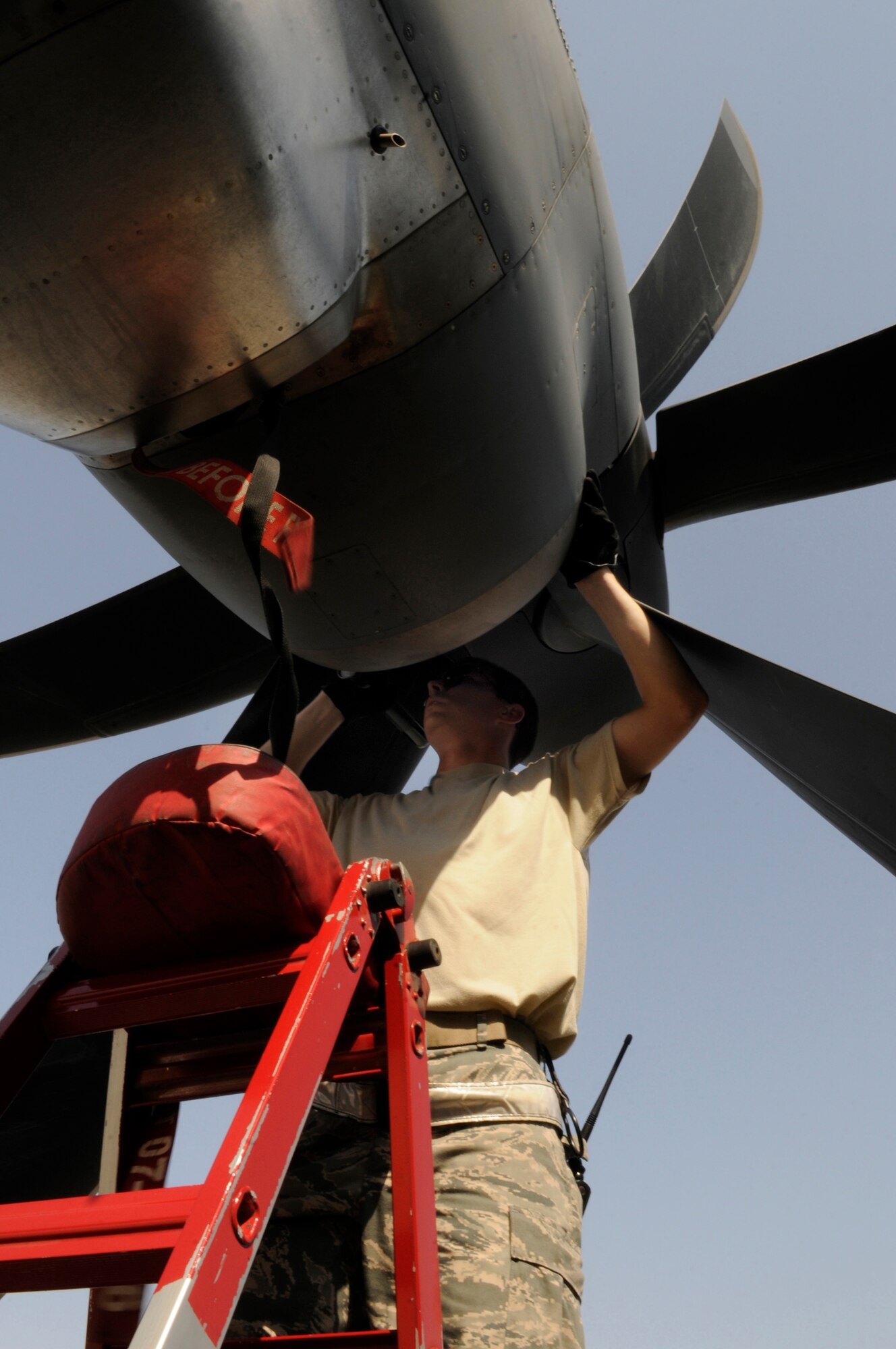 Staff Sgt. Gordon Grgurich, crew chief assigned to the 379th Expeditionary Aircraft Maintenance Squadron, checks the upper air intake on a C-130 Hercules engine prior to covering the intakes as part of a post-flight inspection, Nov. 11, at an undisclosed air base in Southwest Asia.  C-130s are capable of operating from rough, dirt strips and are the prime transport for air dropping troops and equipment into hostile areas within the Central Command area of responsibility.  Sergeant Grgurich hails from Saint Clair, Mo., and is deployed from Little Rock Air Force Base, Ark., in support of Operations Iraqi and Enduring Freedom and Joint Task Force-Horn of Africa.  (U.S. Air Force photo by Tech. Sgt. Michael Boquette/Released)