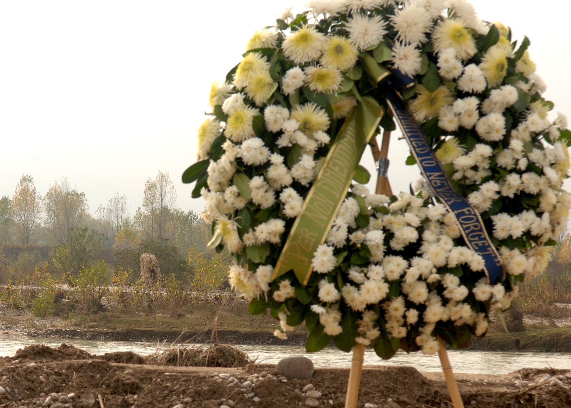 A wreath, placed near the UH-60 Helicopter crash site in Santa Lucia di Piave, Italy, honors those victims of the Nov. 8, 2007 crash. Family members and survivors of the crash gathered at the crash site before the memorial dedication ceremony to honor and remember their loved ones. (U.S. Air Force photo/Senior Airman Taylor Marr)