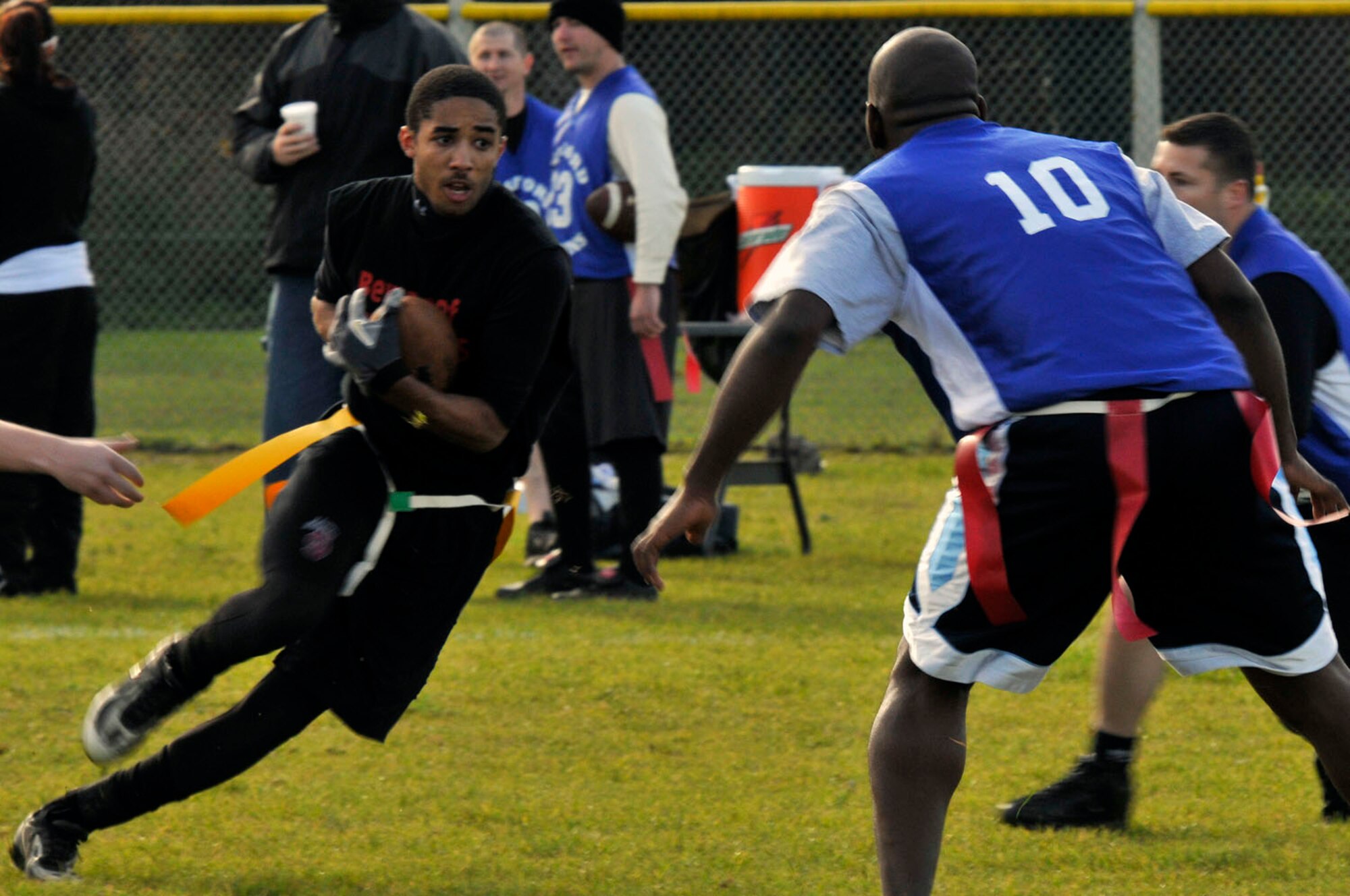 Terrell Powell, Med Dawgs cornerback and wide receiver, works his way up the field against the Fairford Falcons, Nov. 9 at RAF Lakenheath, England. The Lakenheath Med Dawgs defeated the falcon making them the UK Regional Flag Football champions. (U.S. Air Force photo by Airman 1st Class Perry Aston)