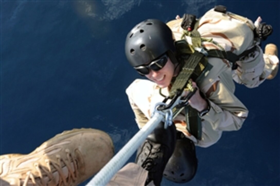 U.S. Navy sailors are lifted from the deck of the aircraft carrier USS Theodore Roosevelt and transported over the Gulf of Oman during a special patrol insertion and extraction exercise, Nov. 7, 2008. The sailors are assigned to Explosive Ordnance Disposal Platoon 222.