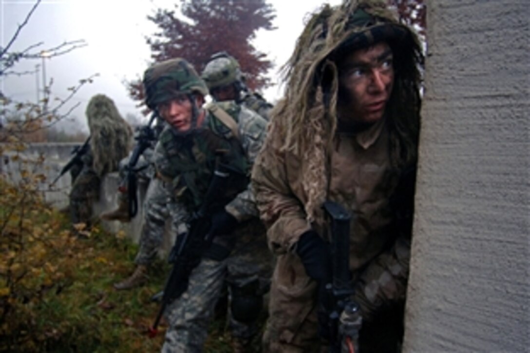 U.S. Army Spc. Nicholas Ranstad, right leads a fire team of Air Force joint terminal air controllers in search of a high-value target during an exercise in support of Allied Strike II at U.S. Army Garrison Hohenfels, Germany, Nov. 6, 2008. Allied Strike II is a combine U.S. and coalition forces exercise that trains joint terminal attack control members in preparation for deployments in support of Operation Iraqi Freedom and Operation Enduring Freedom.