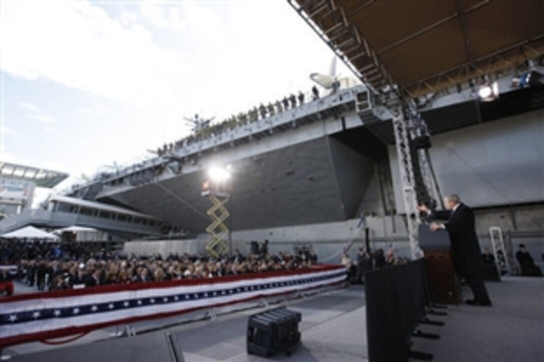 President George W. Bush gestures as he addresses his remarks in honor of Veteran's Day Tuesday, Nov. 11, 2008, at the rededication ceremony of the Intrepid Sea, Air and Space Museum in New York. 