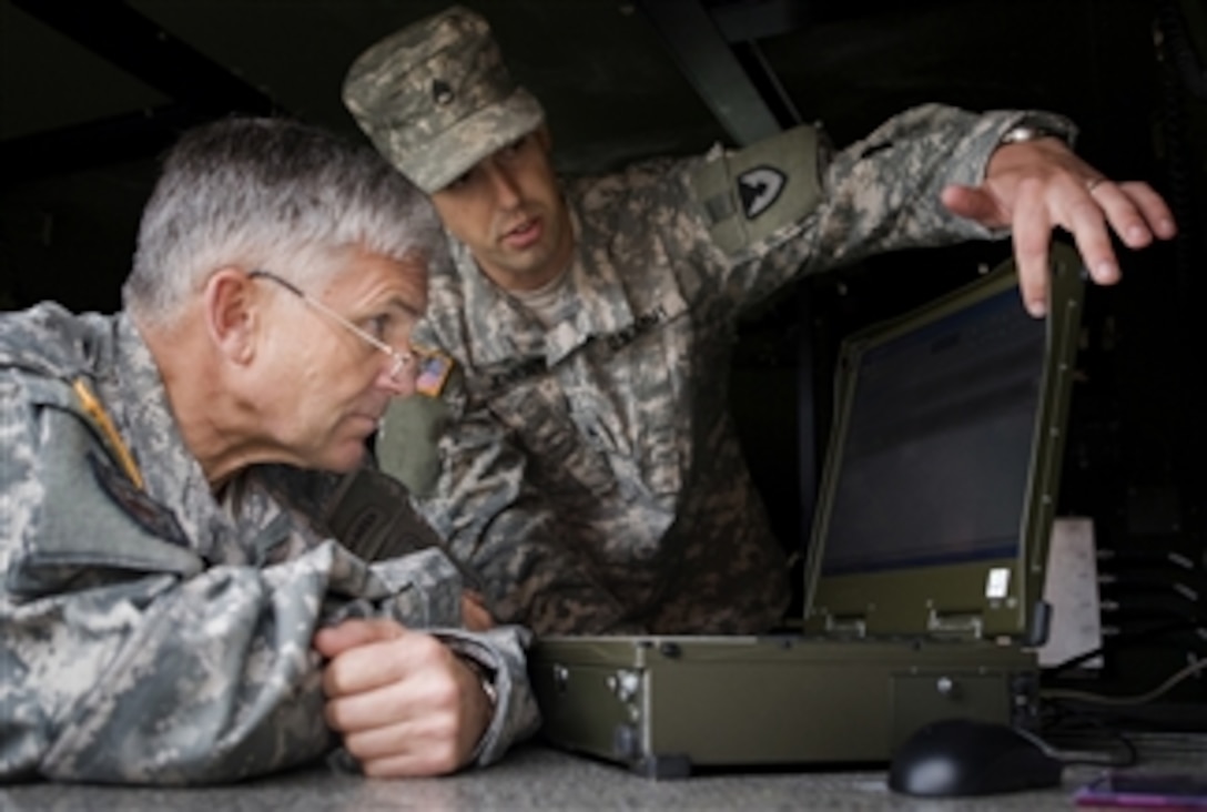U.S. Army Staff Sgt. Jenkins briefs Chief of Staff of the Army Gen. George W. Casey Jr. on different technologies being incorporated into the war on terror at Ft. Monmouth, N.J., on Nov. 5, 2008.  