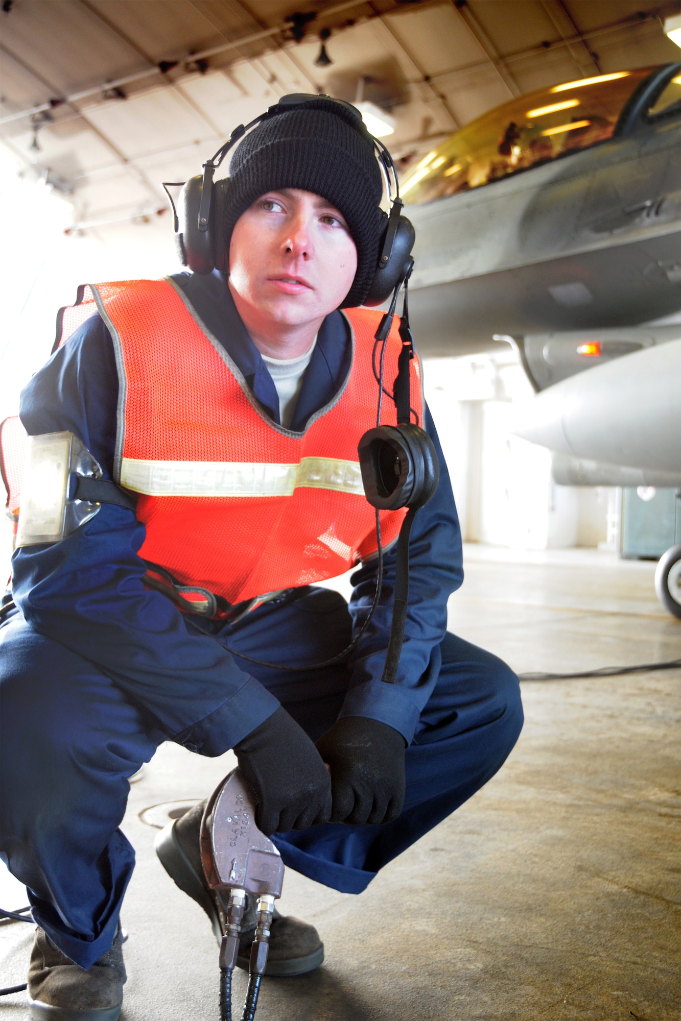 MISAWA AIR BASE, Japan -- Staff Sgt. Michael Botti, 35th Aircraft Maintenance Squadron crew chief, operates a "dead man," during the hot-pit refueling of an F-16, Nov. 10, 2008. Different from normal refueling of a jet, the crew chief, who has direct communication with the pilot, operates the dead man and can immediately stop fuel flow in the case of an emergency. (U.S. Air Force photo by Airman 1st Class Jamal D. Sutter)    
