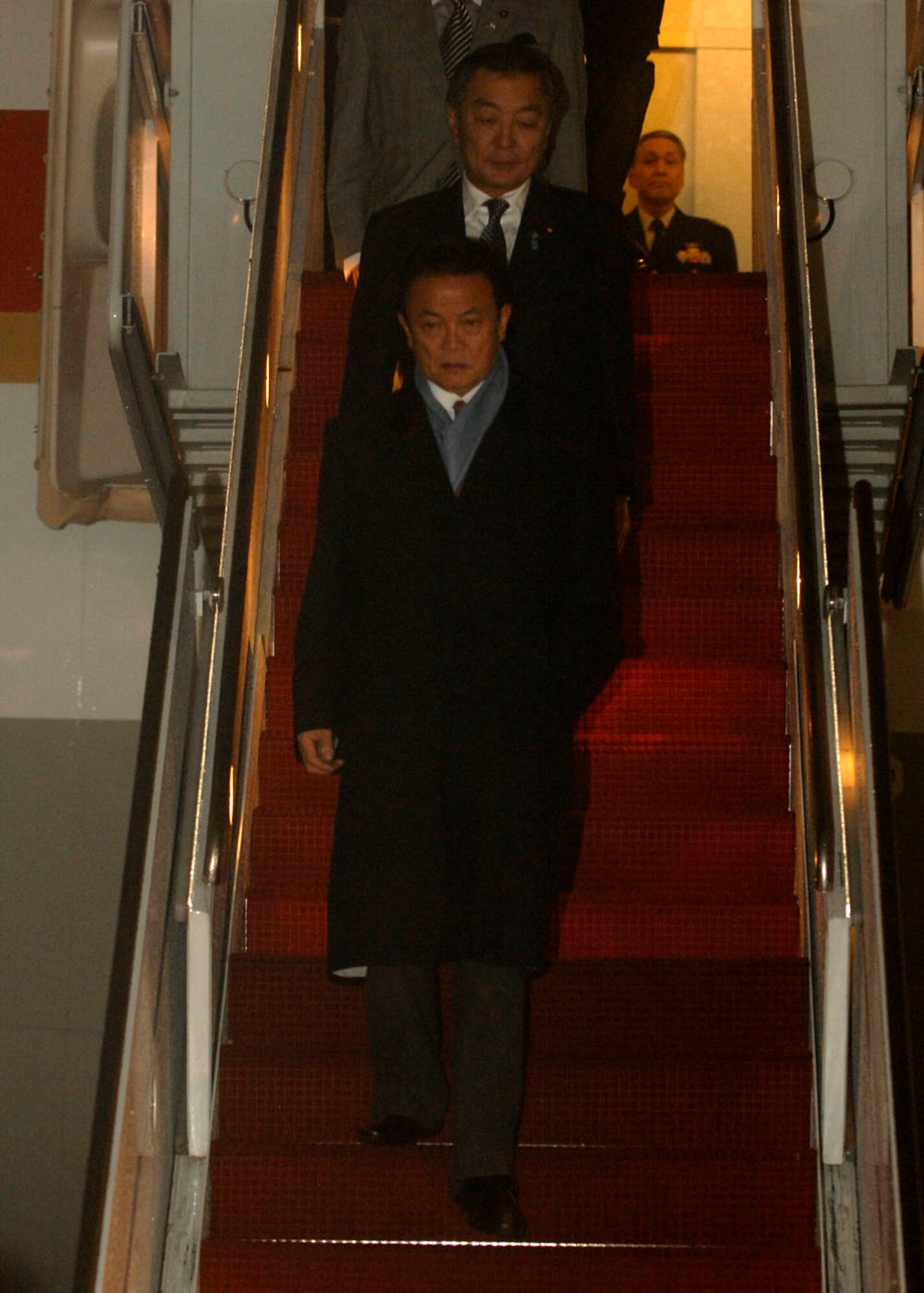 Japanese Prime Minister Taro Aso lands at Andrews Air Force Base, Md., Nov.13, 2008, for the two-day G20 Summit at the White House in Washington.  The summit, hosted by U.S. President George W. Bush, will bring together world leaders to discuss the increasing global financial crisis, its causes and efforts to resolve it. (U.S. Air Force photo by Senior Airman Melissa Stonecipher)