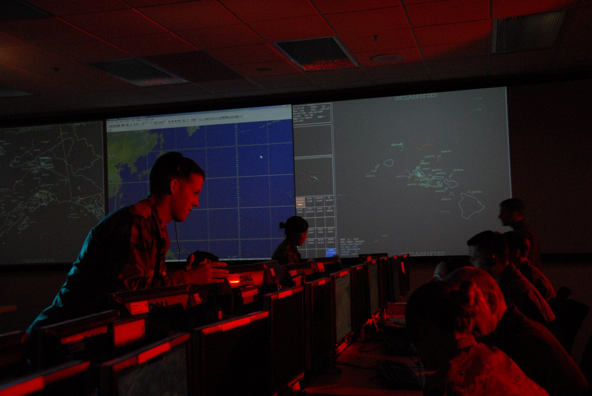 HICKAM AIR FORCE BASE, Hawaii-- Personnel on the 613th Air and Space Operations Center floor provide command and control for air and space operations within the Pacific theater. (U.S. Air Force photo by Tech. Sgt. Justin Huett)
